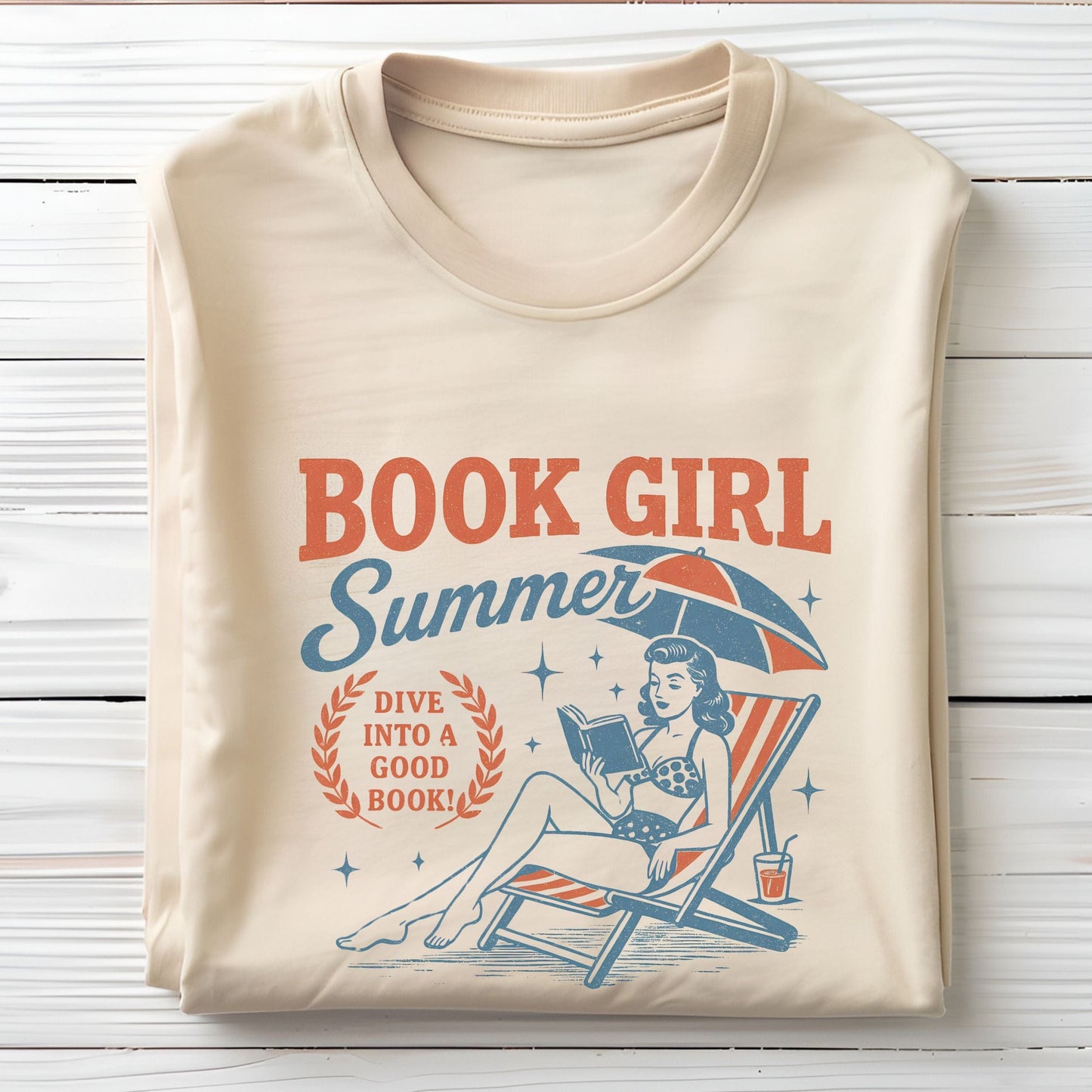 Folded t-shirt with vintage-style swimmer and book illustration in soft cream
