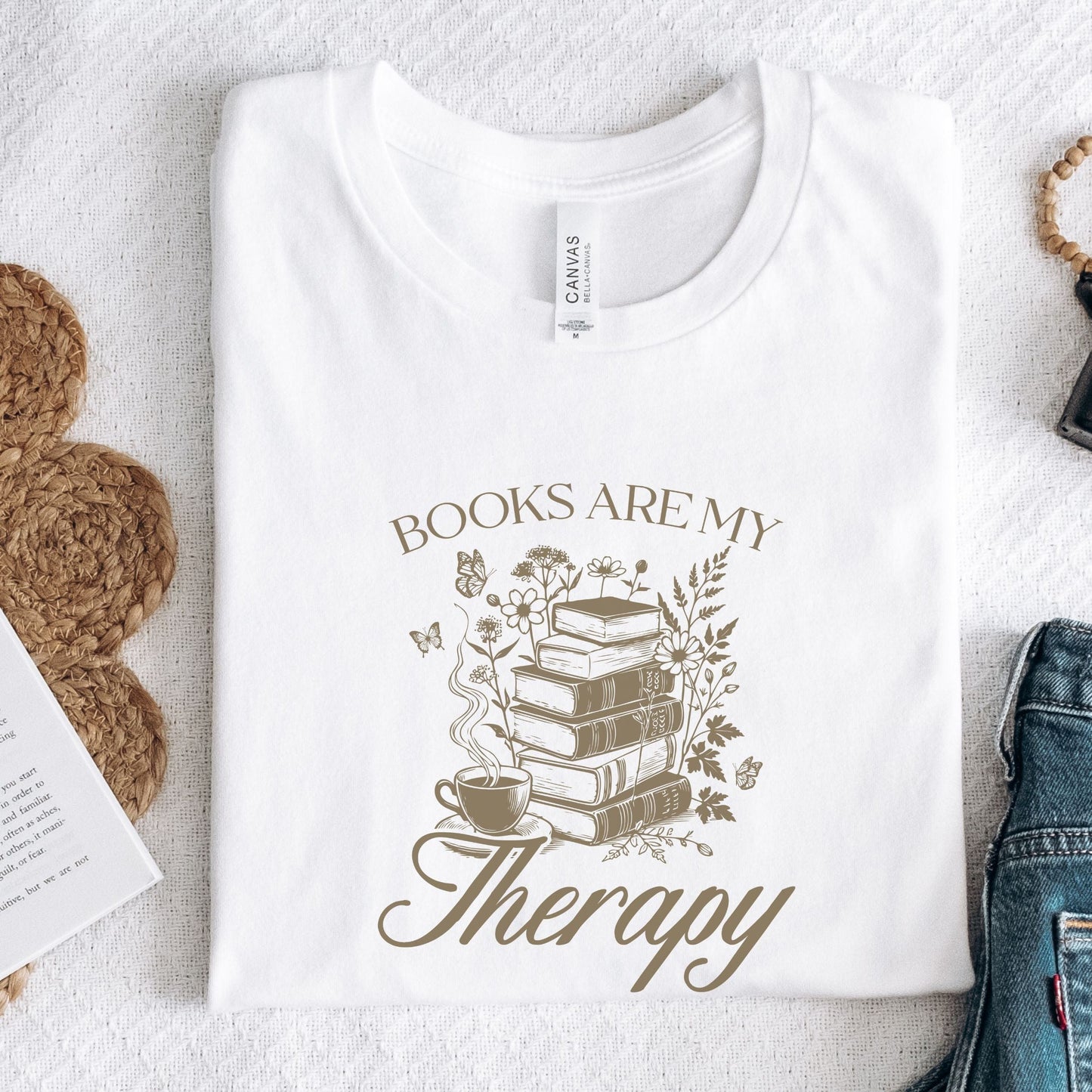 “Books Are My Therapy” t-shirt with vintage floral book stack, butterflies, and a coffee cup — perfect for cozy book lovers.