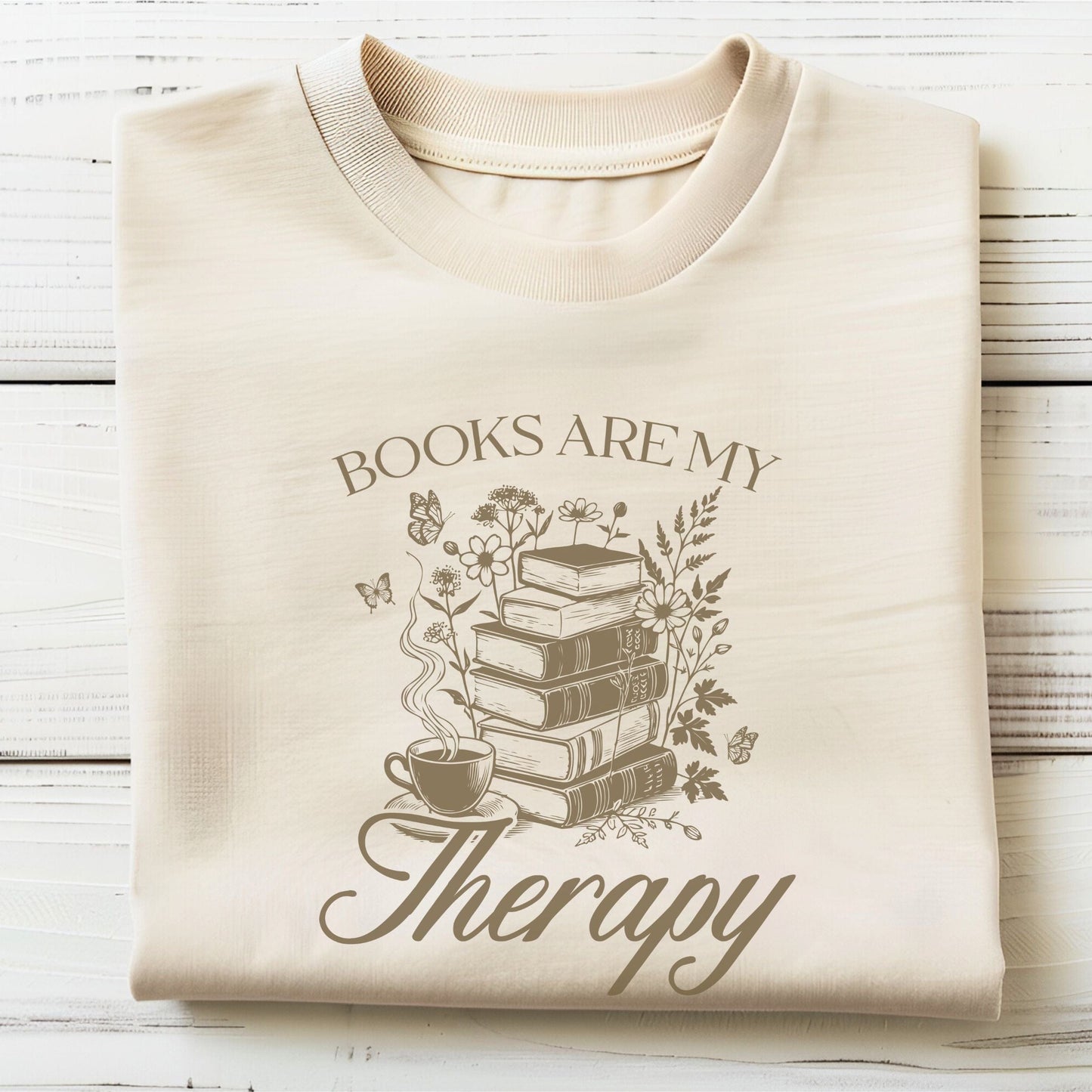“Books Are My Therapy” t-shirt with vintage floral book stack, butterflies, and a coffee cup — perfect for cozy book lovers.