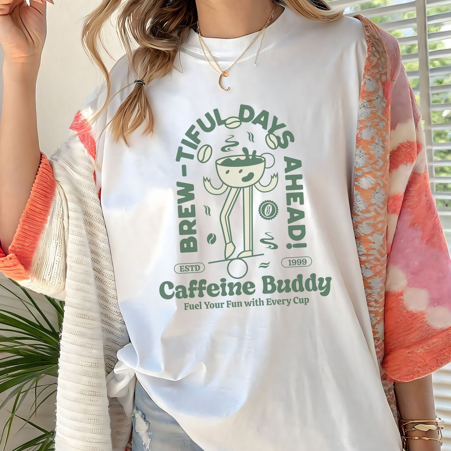 Unisex t-shirt featuring a retro cartoon coffee cup design with the phrase “Caffeine Buddy: Brew-tiful Days Ahead.” Great for coffee lovers and cozy style fans.