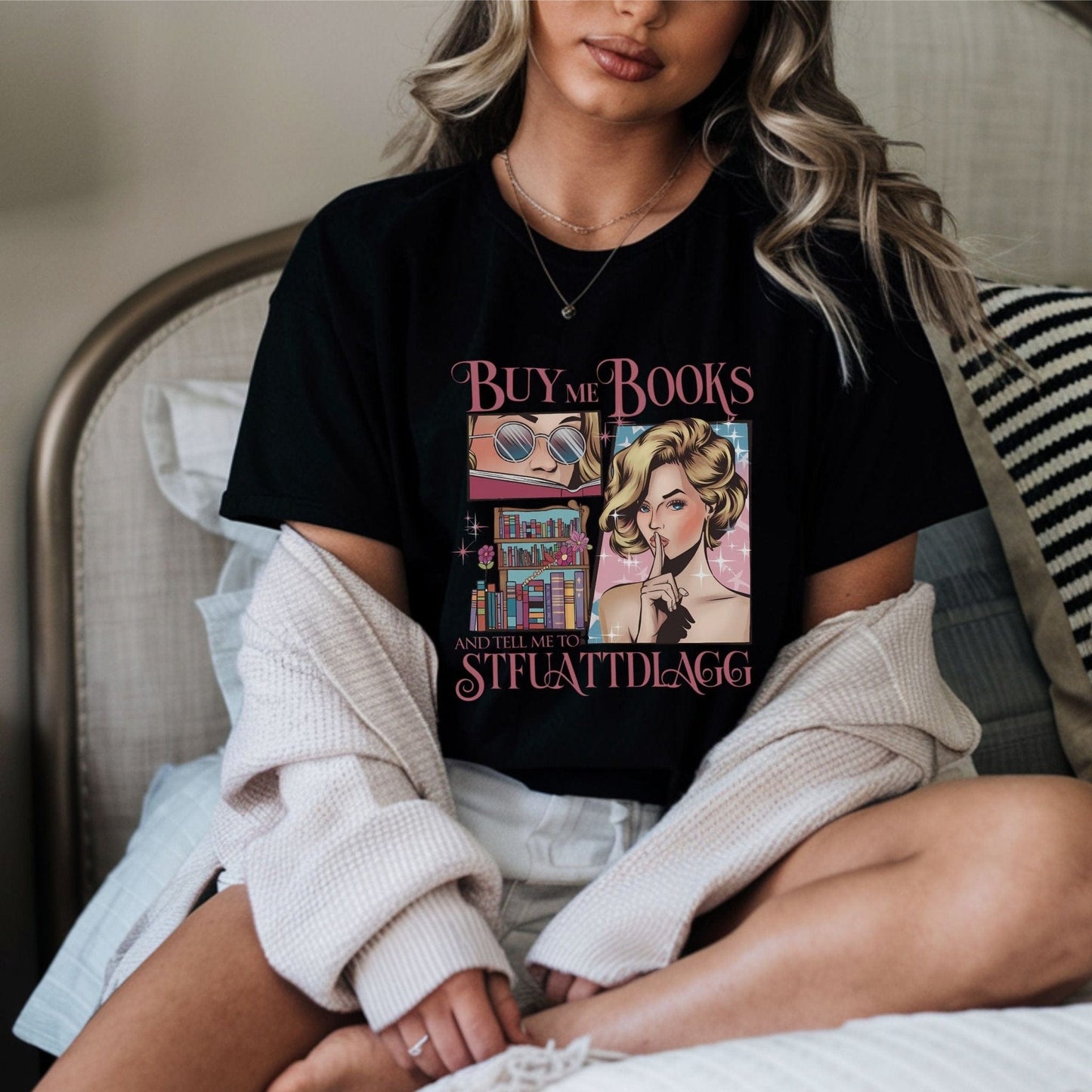 “Buy Me Books and Tell Me to STFUATTDLAGG” t-shirt with retro glam comic art, sassy woman, bookshelves, and pink sparkly accents.