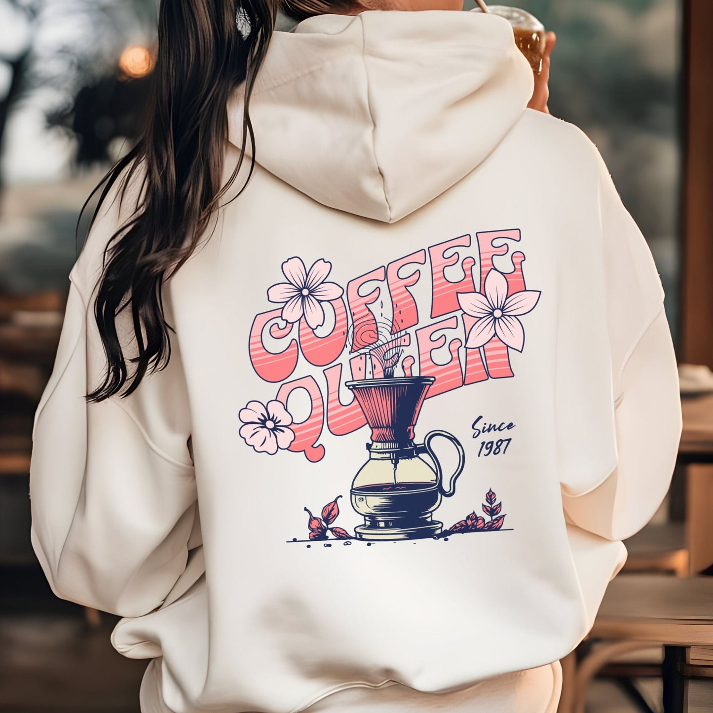 Retro-style “Coffee Queen” text with floral accents and a coffee pour-over illustration on back of a hoodie
