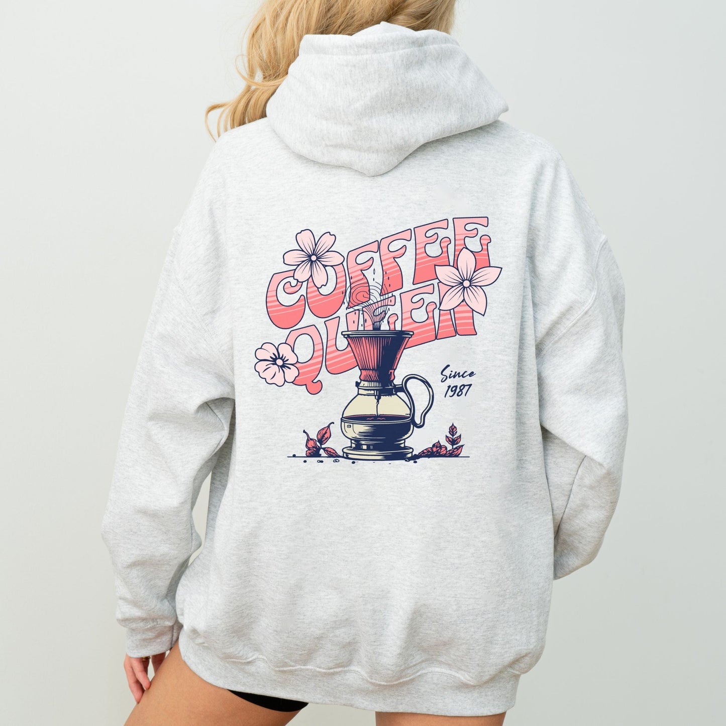 Retro-style “Coffee Queen” text with floral accents and a coffee pour-over illustration on back of a hoodie