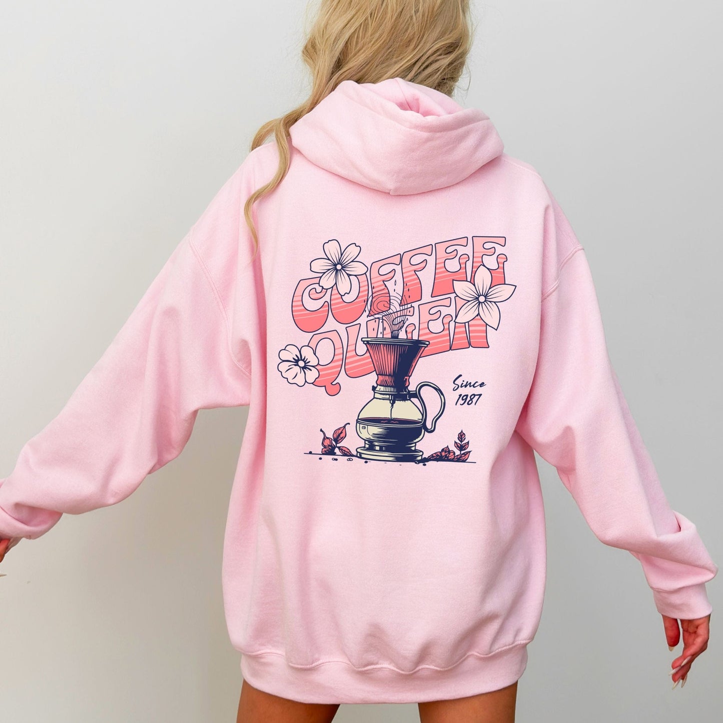 Retro-style “Coffee Queen” text with floral accents and a coffee pour-over illustration on back of a hoodie