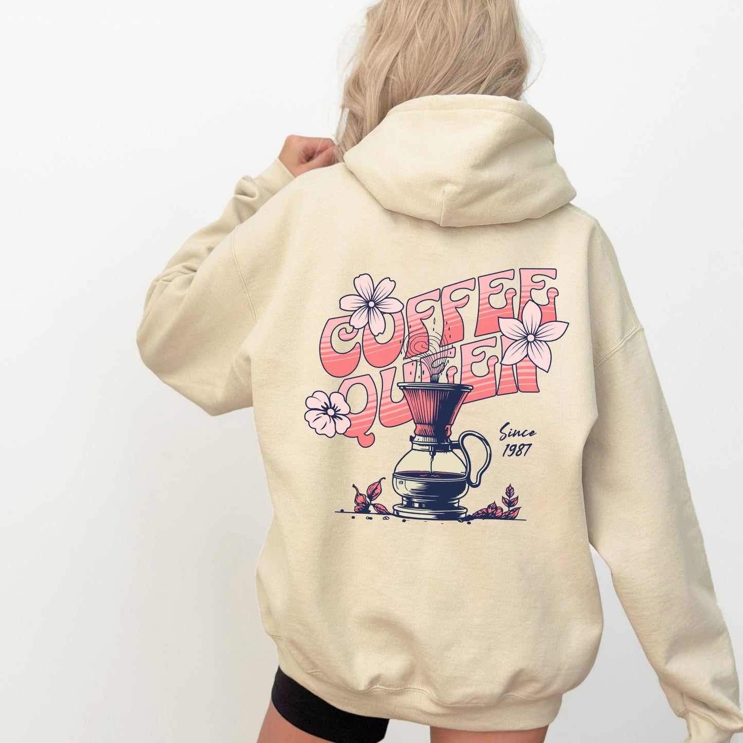Retro-style “Coffee Queen” text with floral accents and a coffee pour-over illustration on back of a hoodie