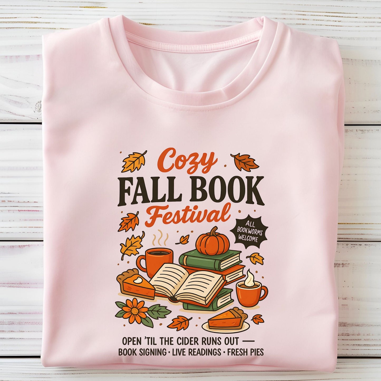 Cozy Fall Book Festival t-shirt with books, pumpkin pie, cider mugs, and autumn leaves in retro fall colors.