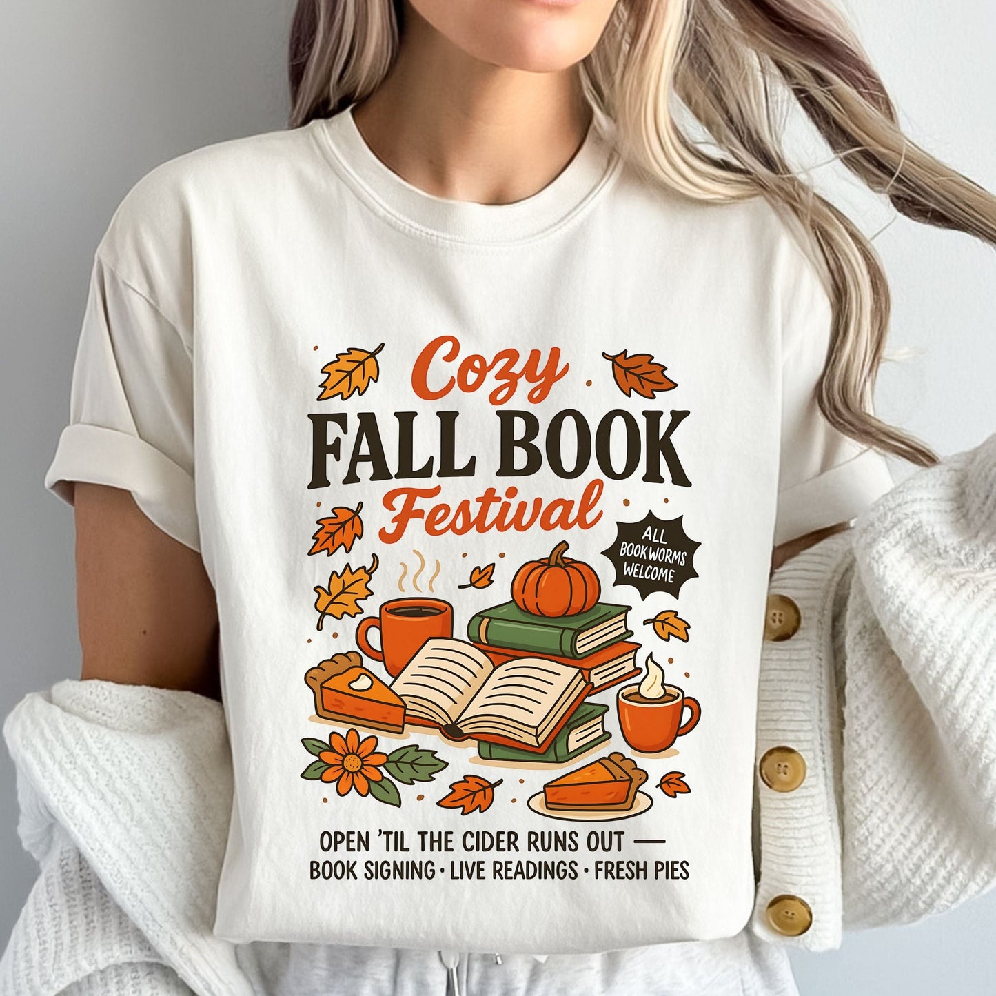 Cozy Fall Book Festival t-shirt with books, pumpkin pie, cider mugs, and autumn leaves in retro fall colors.