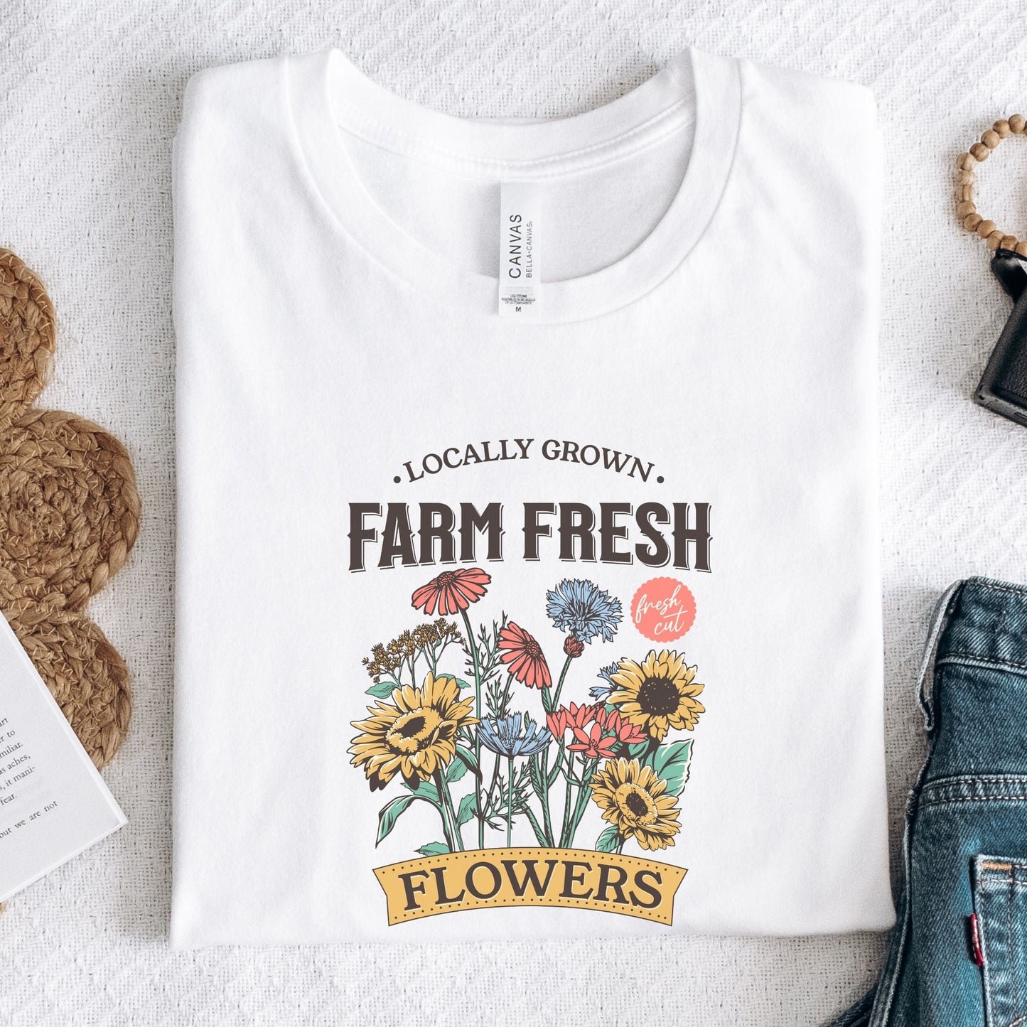 “Farm Fresh Flowers” t-shirt with vintage hand-drawn wildflowers, sunflowers, and colorful bouquet design. Includes “Locally Grown” and “Fresh Cut” text.