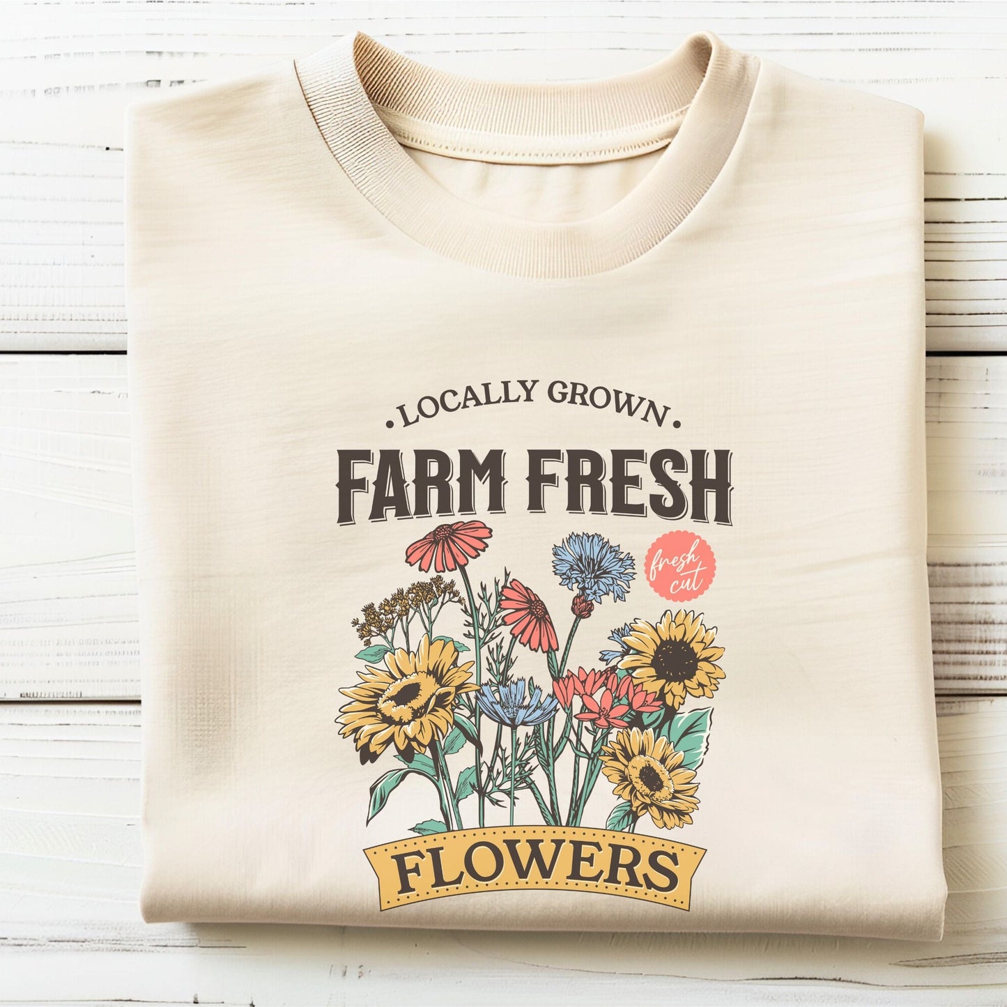 “Farm Fresh Flowers” t-shirt with vintage hand-drawn wildflowers, sunflowers, and colorful bouquet design. Includes “Locally Grown” and “Fresh Cut” text.