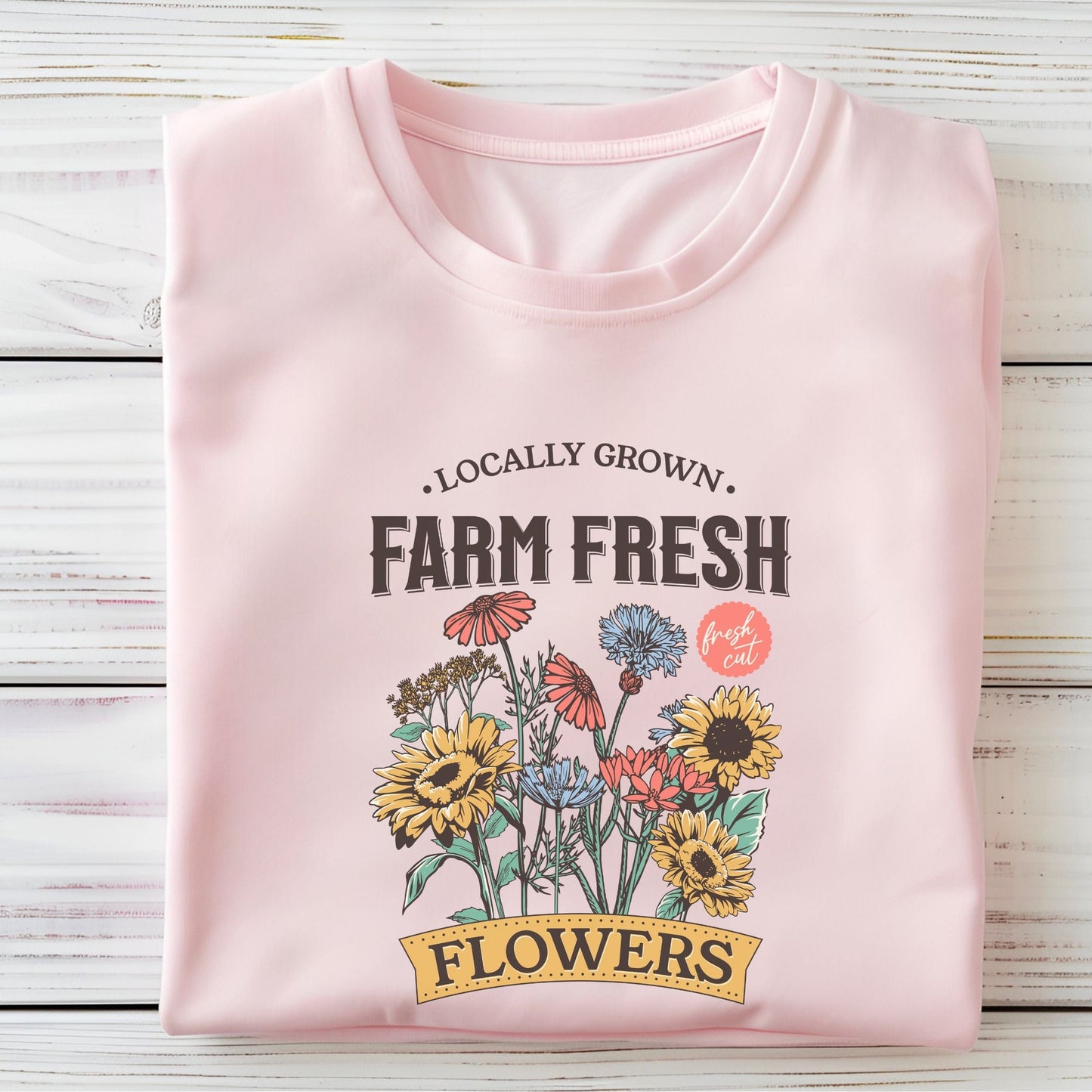 “Farm Fresh Flowers” t-shirt with vintage hand-drawn wildflowers, sunflowers, and colorful bouquet design. Includes “Locally Grown” and “Fresh Cut” text.