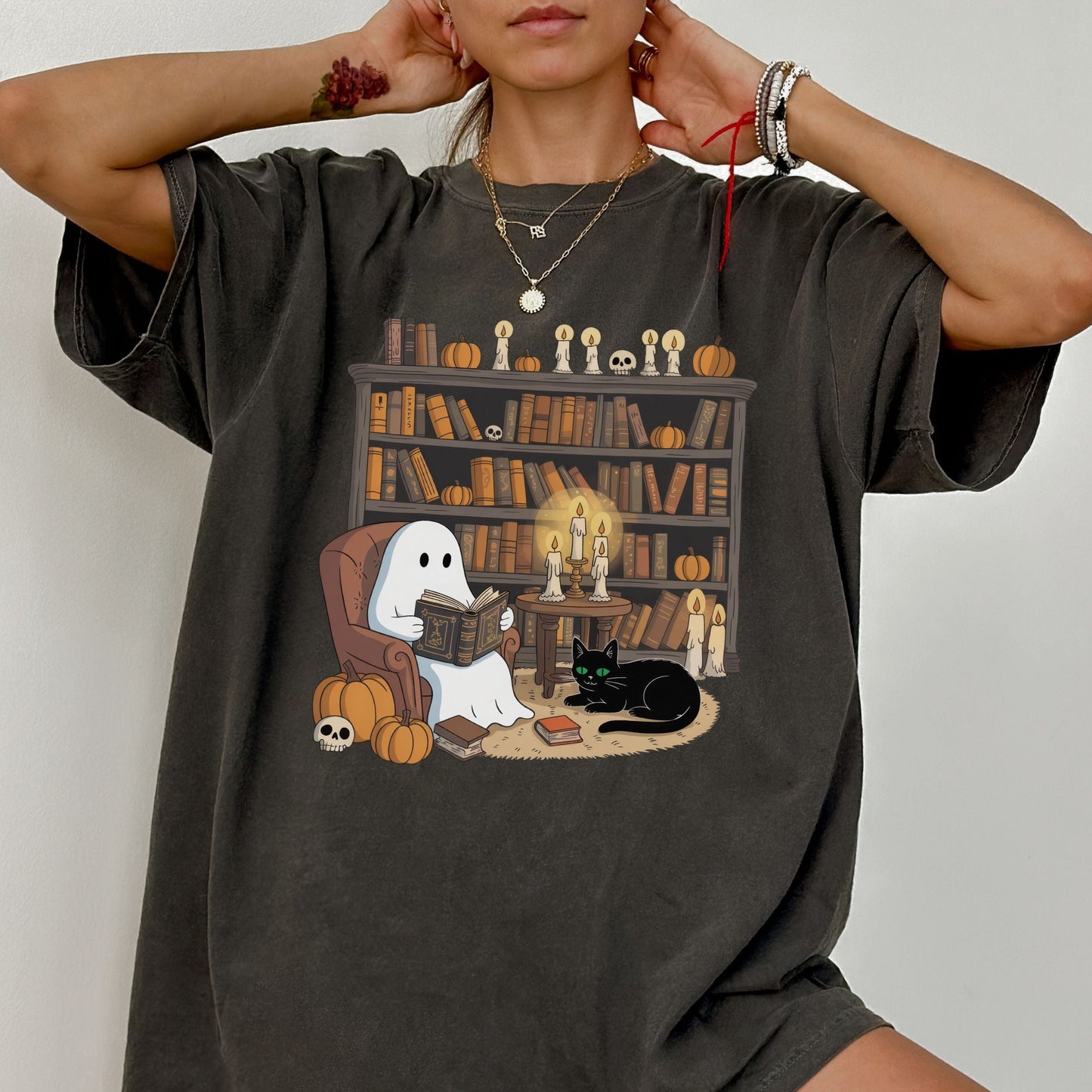 Cute ghost reading a book in a cozy library with pumpkins, candles, and a black cat for Halloween.