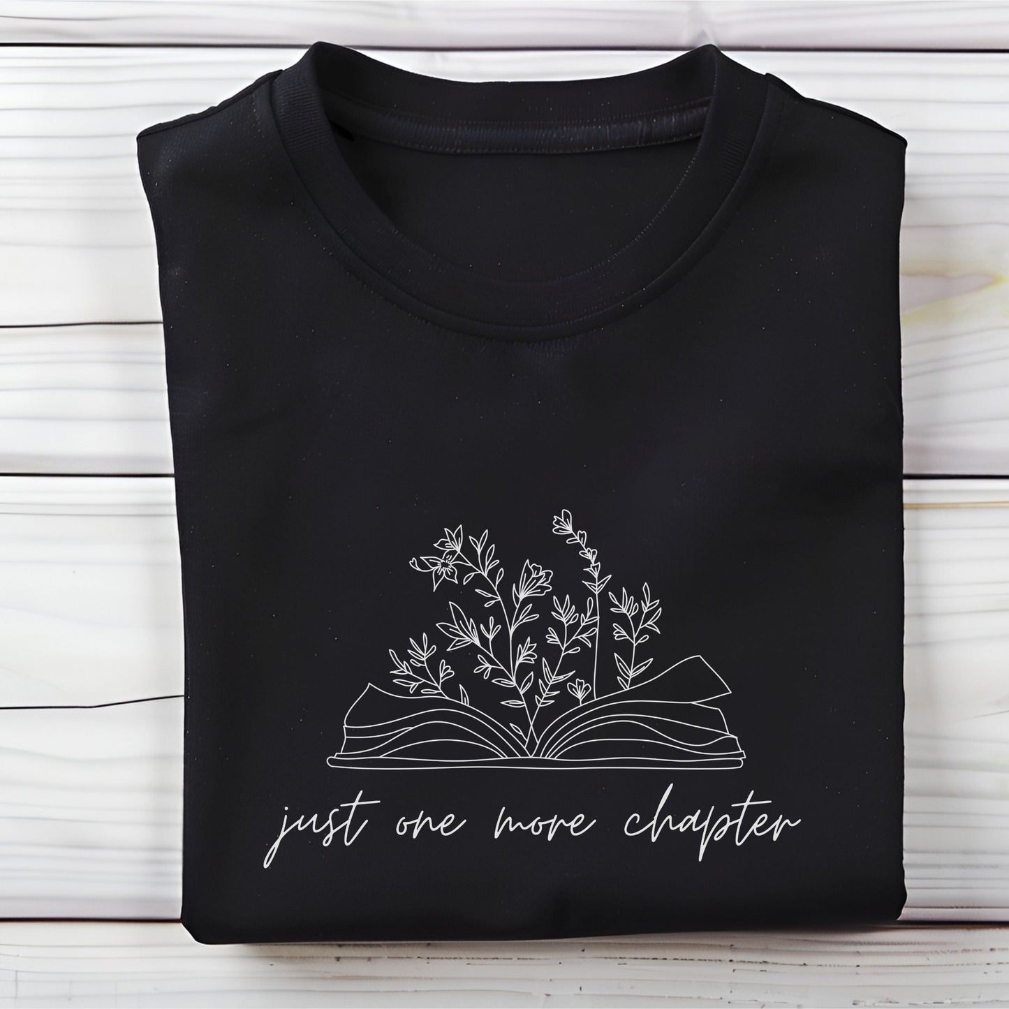 “Just One More Chapter” t-shirt with floral book line art — minimal design perfect for book lovers and cozy, casual style.