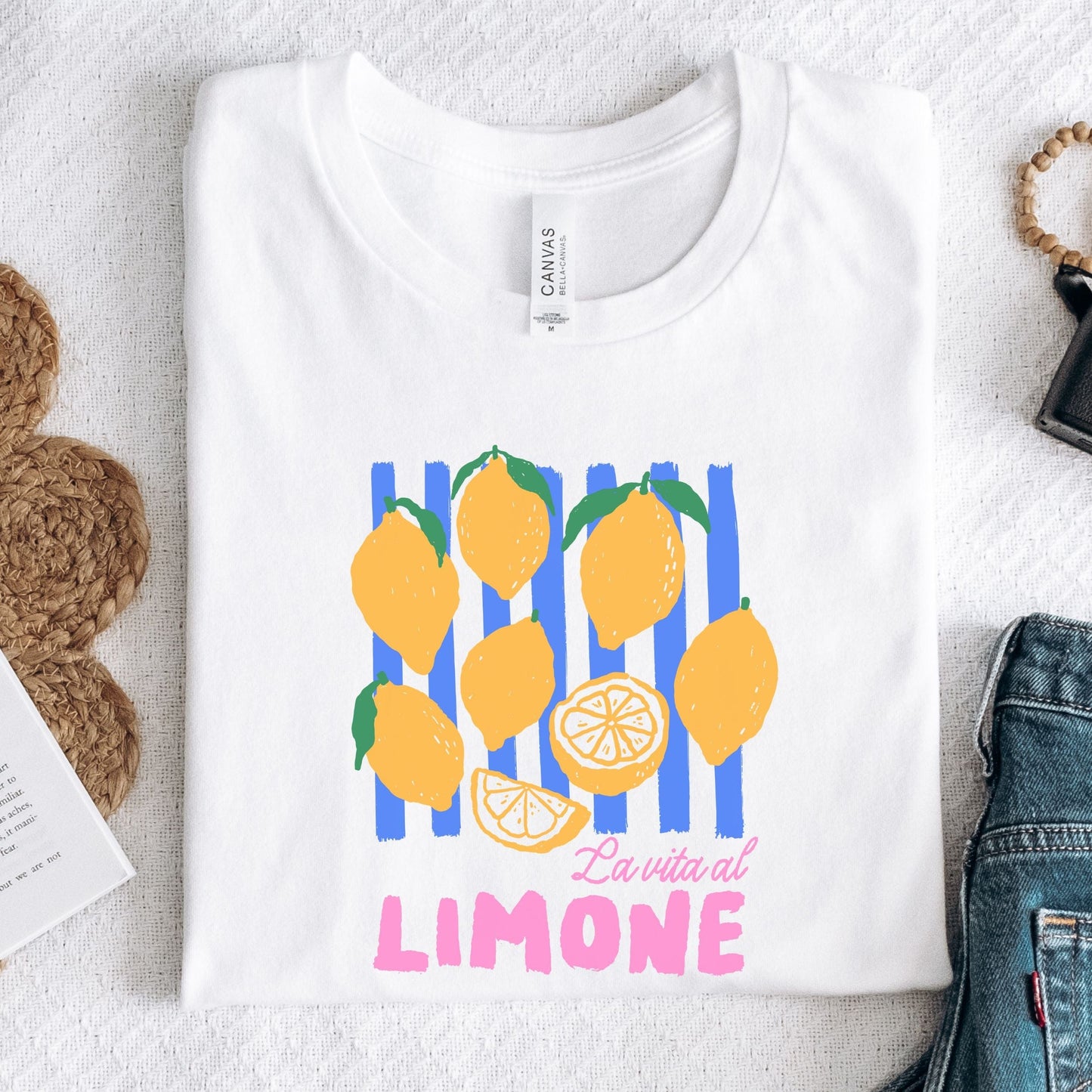 Colorful hand-drawn lemons with text that reads “La Vita al Limone” in pink and white