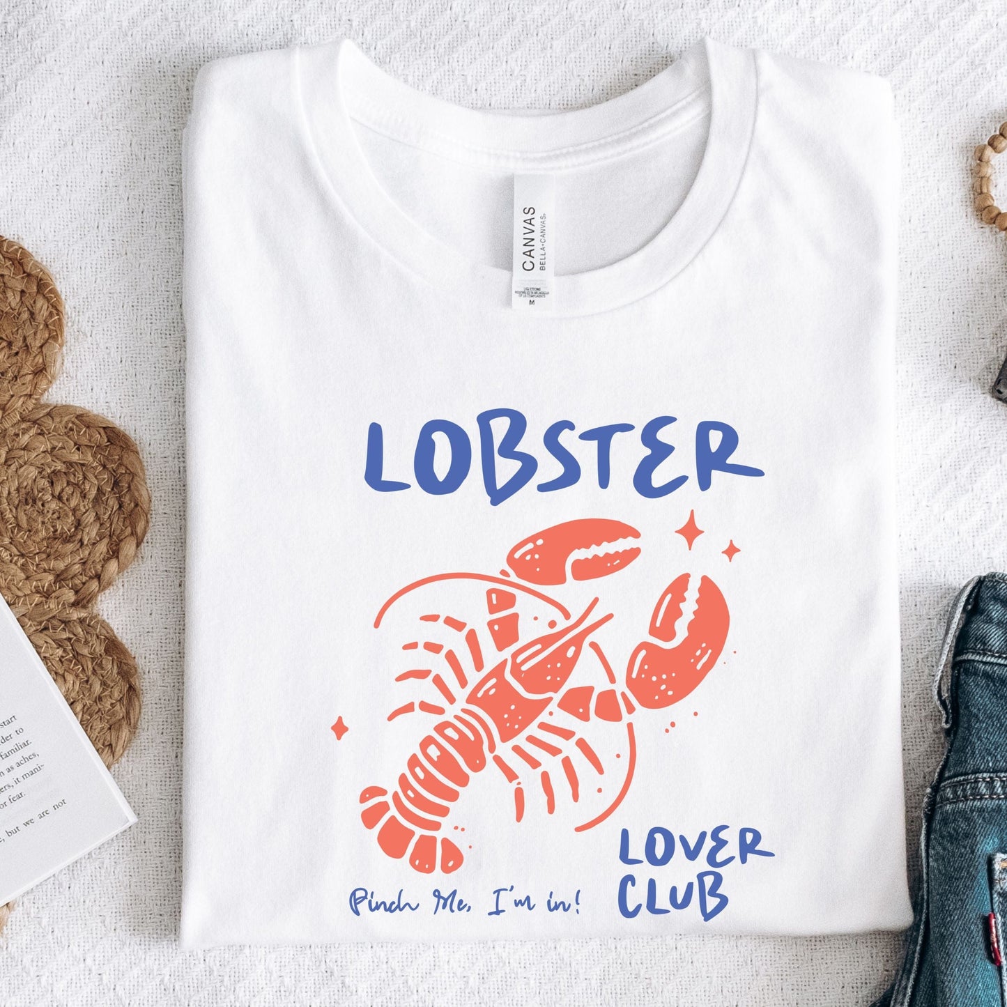 Colorful cartoon lobster with the phrase "Lobster Lover Club – Pinch Me, I'm In!" on a fun summer t-shirt for seafood and beach lovers.
