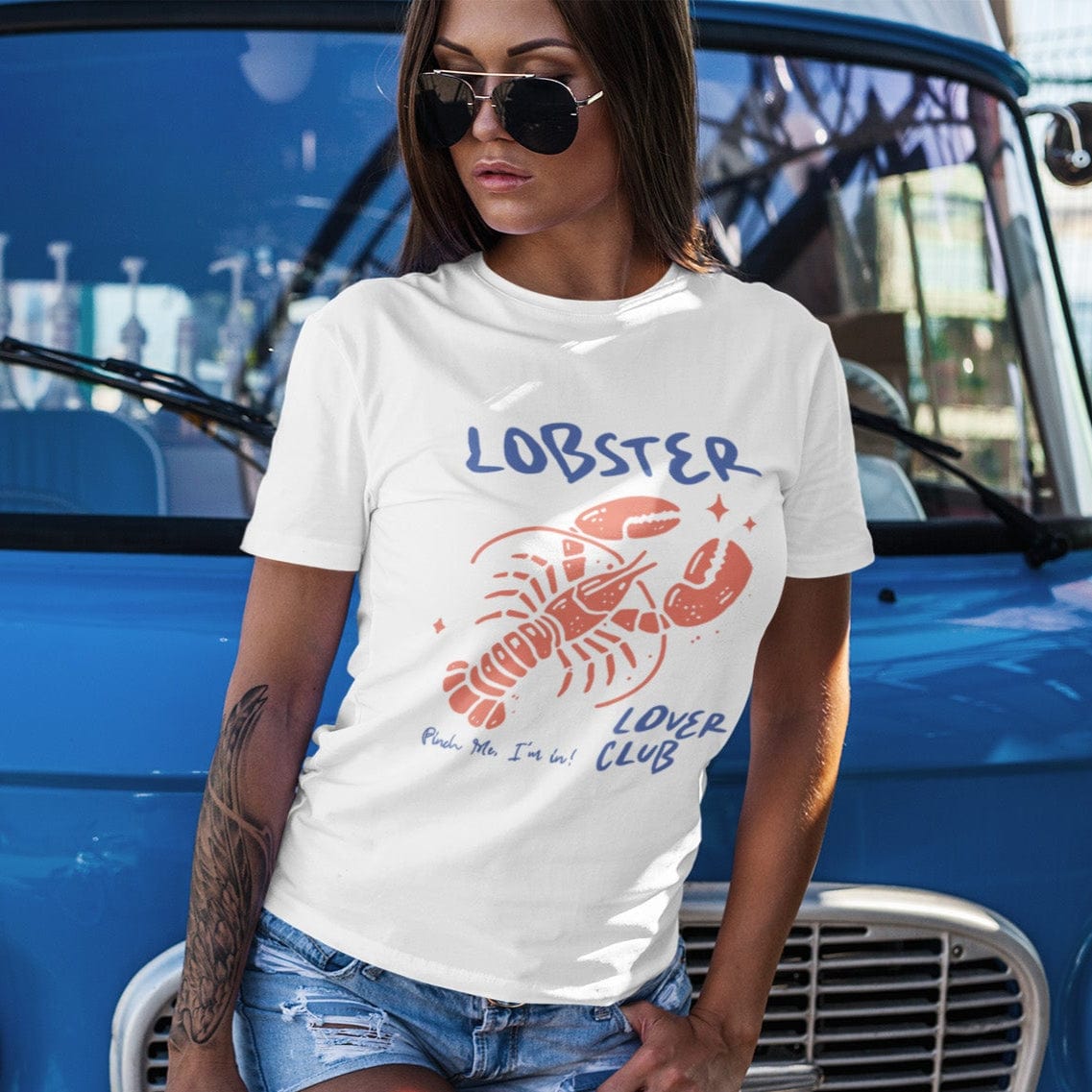 Colorful cartoon lobster with the phrase "Lobster Lover Club – Pinch Me, I'm In!" on a fun summer t-shirt for seafood and beach lovers.