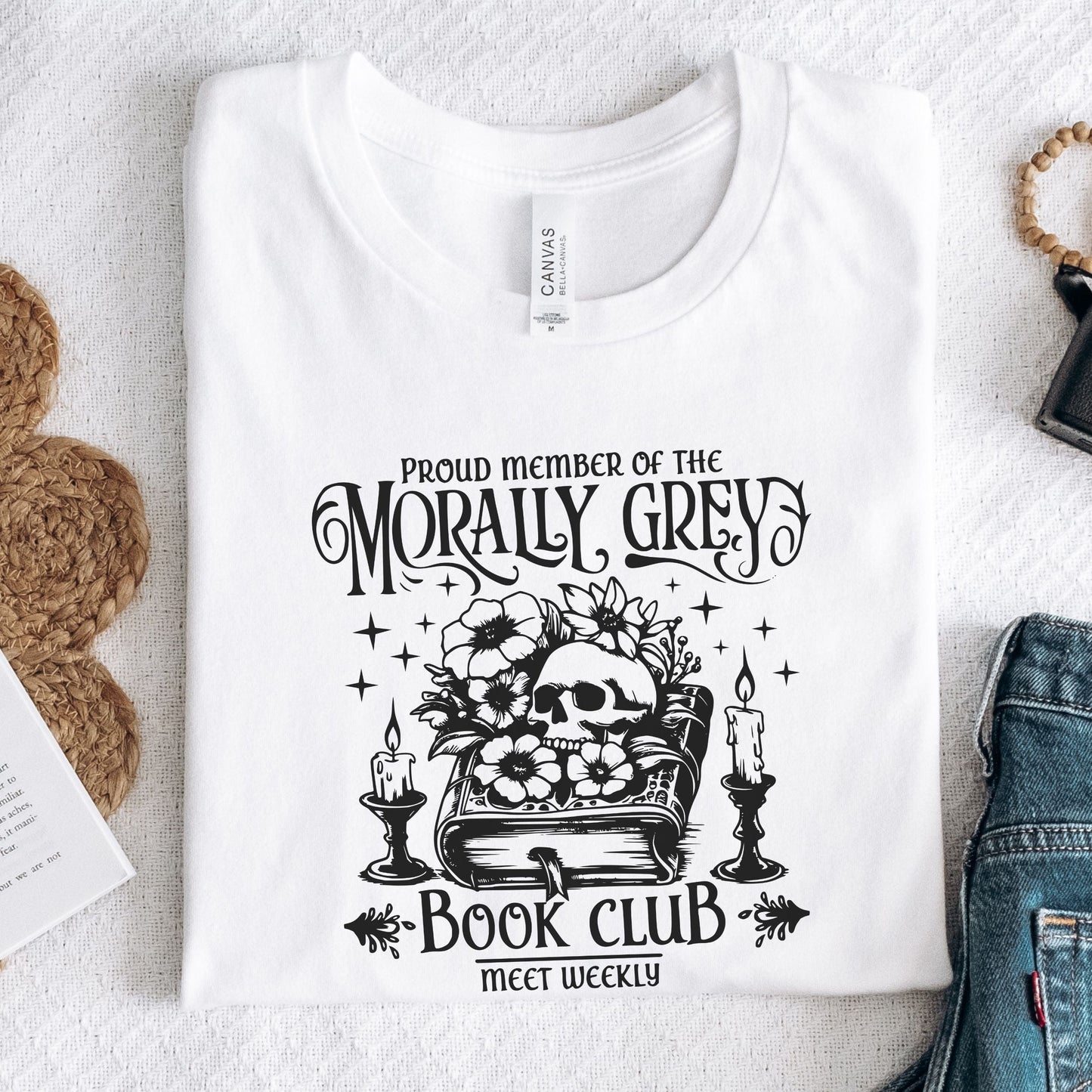 Folded t-shirt with dark fantasy-style text design in white