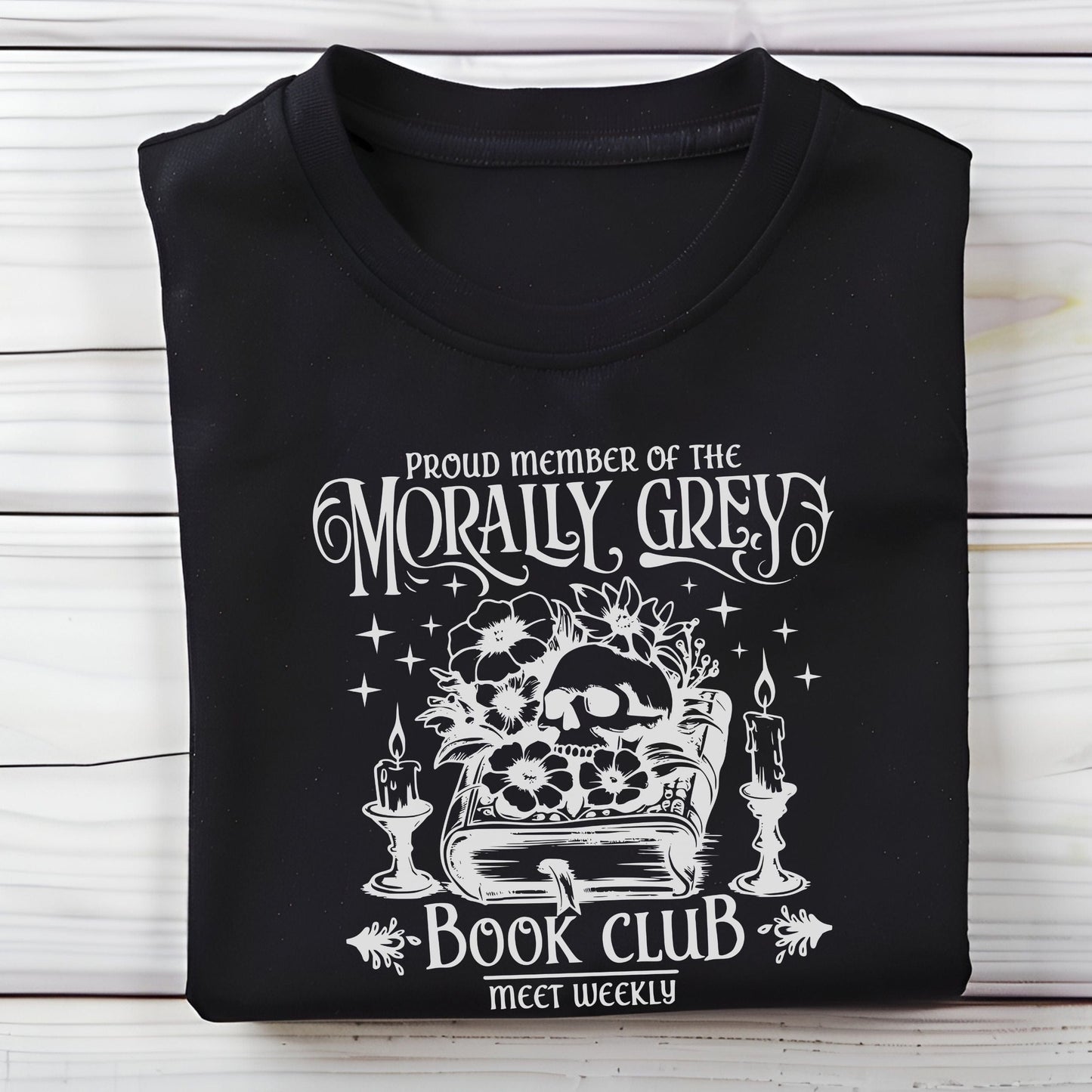 Folded t-shirt with dark fantasy-style text design in black