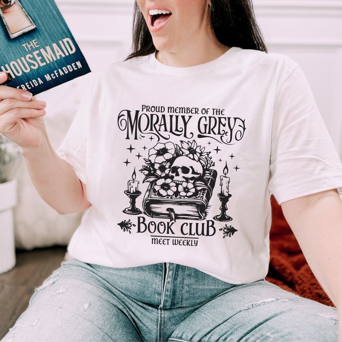Person wearing “Morally Grey Book Club” t-shirt with gothic typography