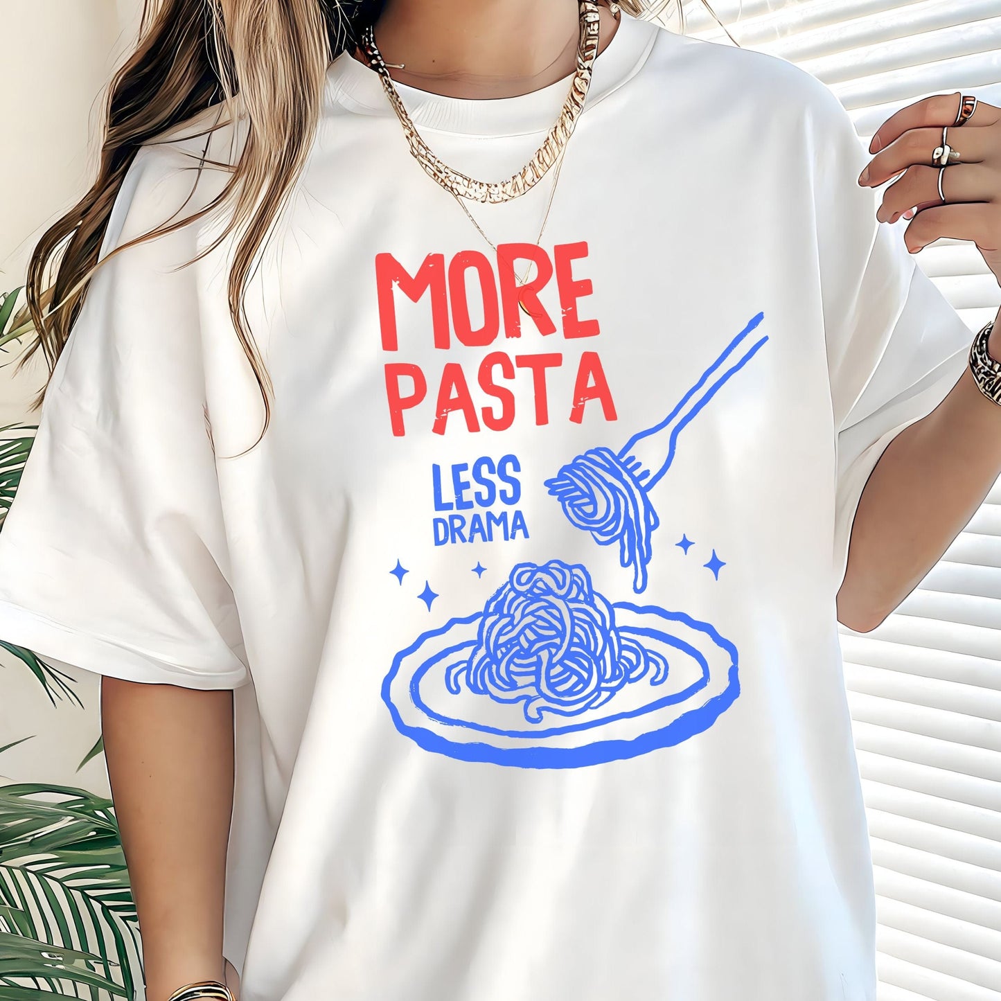 T-shirt with a plate of spaghetti and fork illustration and “More Pasta, Less Drama” text in white