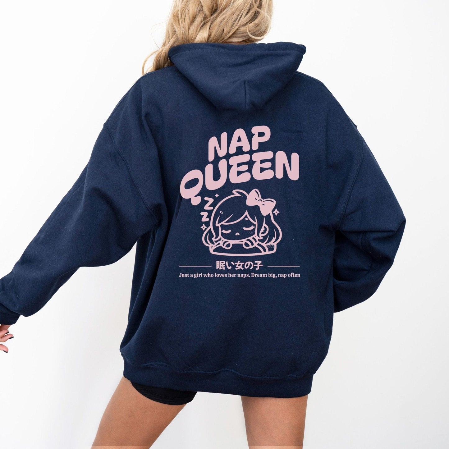Hoodie with back print featuring "Nap Queen" text, a sleepy girl with bow, Zzz symbols, and kawaii-inspired style — perfect for cozy nap lovers.