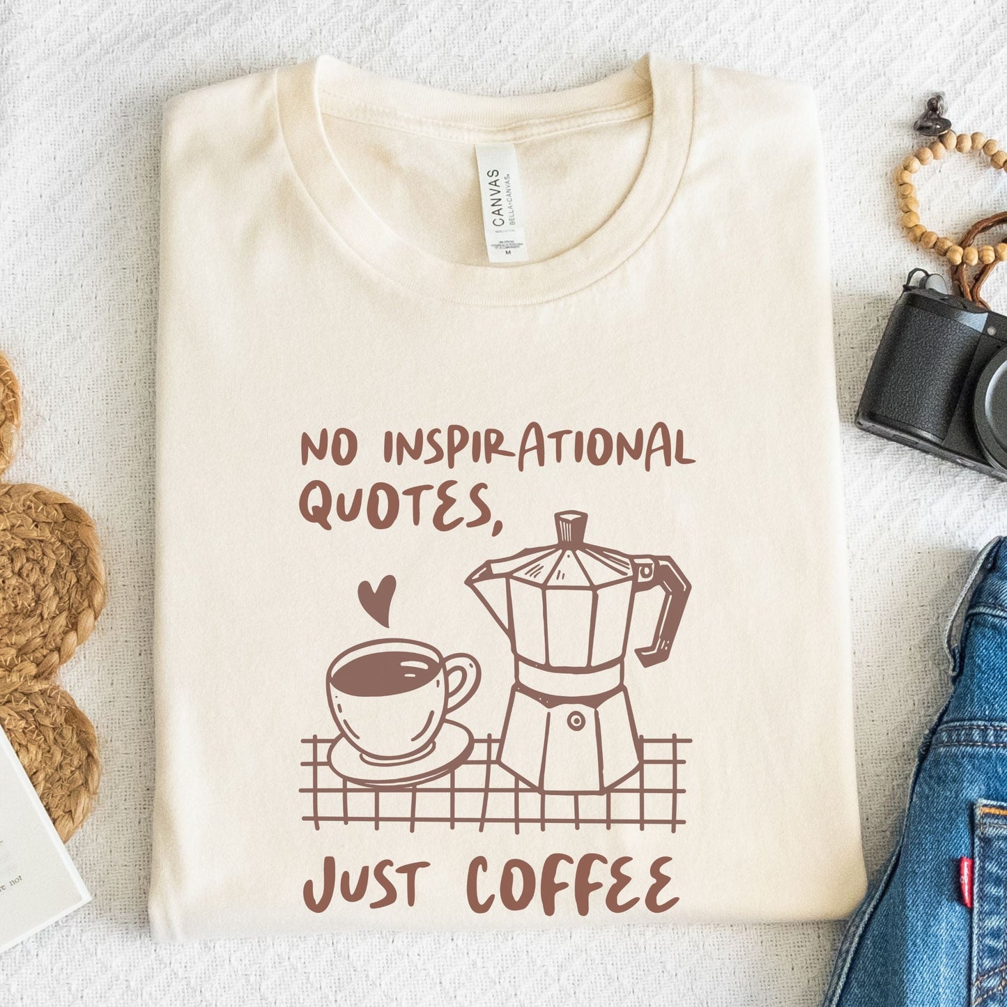 Minimalist text graphic tee that reads “No inspirational quotes. Just coffee.”