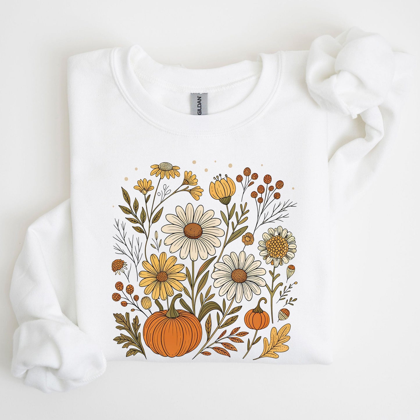 Pumpkin and wildflower fall sweatshirt in neutral tones, cozy autumn cottagecore style