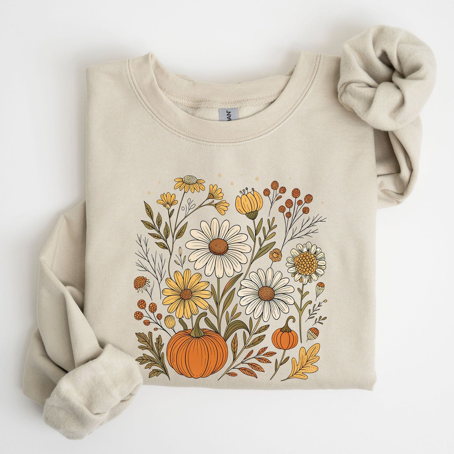 Pumpkin and wildflower fall sweatshirt in neutral tones, cozy autumn cottagecore style