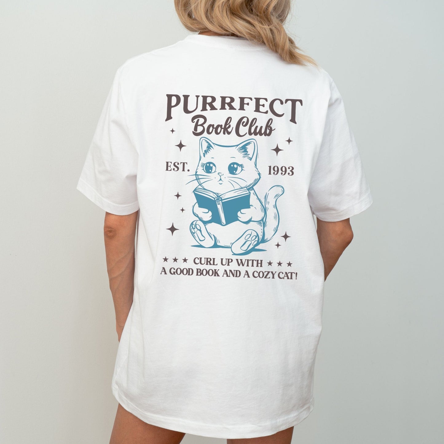 Illustrated cat reading a book with “Purrfect Book Club” text in white