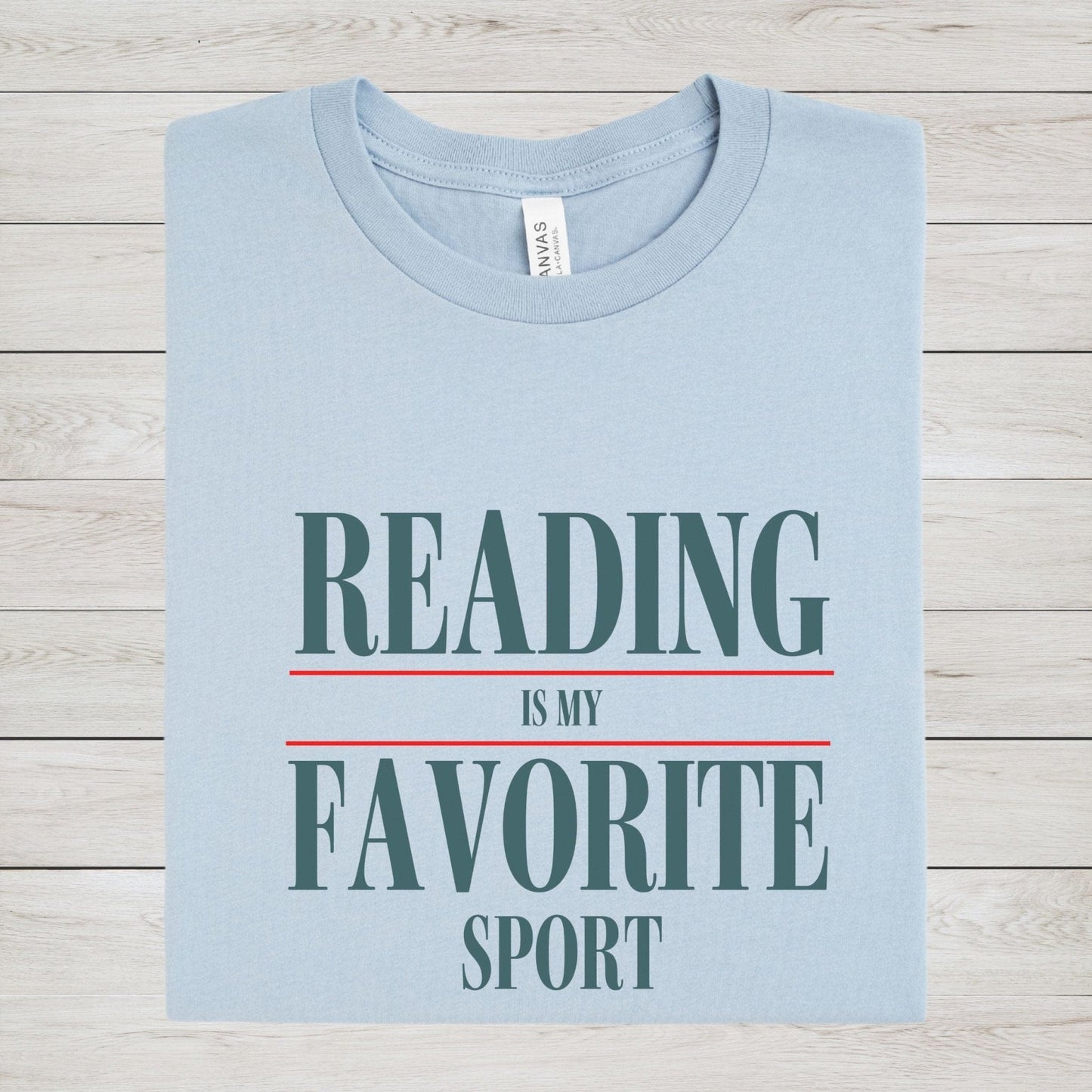 “Reading Is My Favorite Sport” t-shirt with bold serif font in dark teal and red underline accents, minimalist literary design.