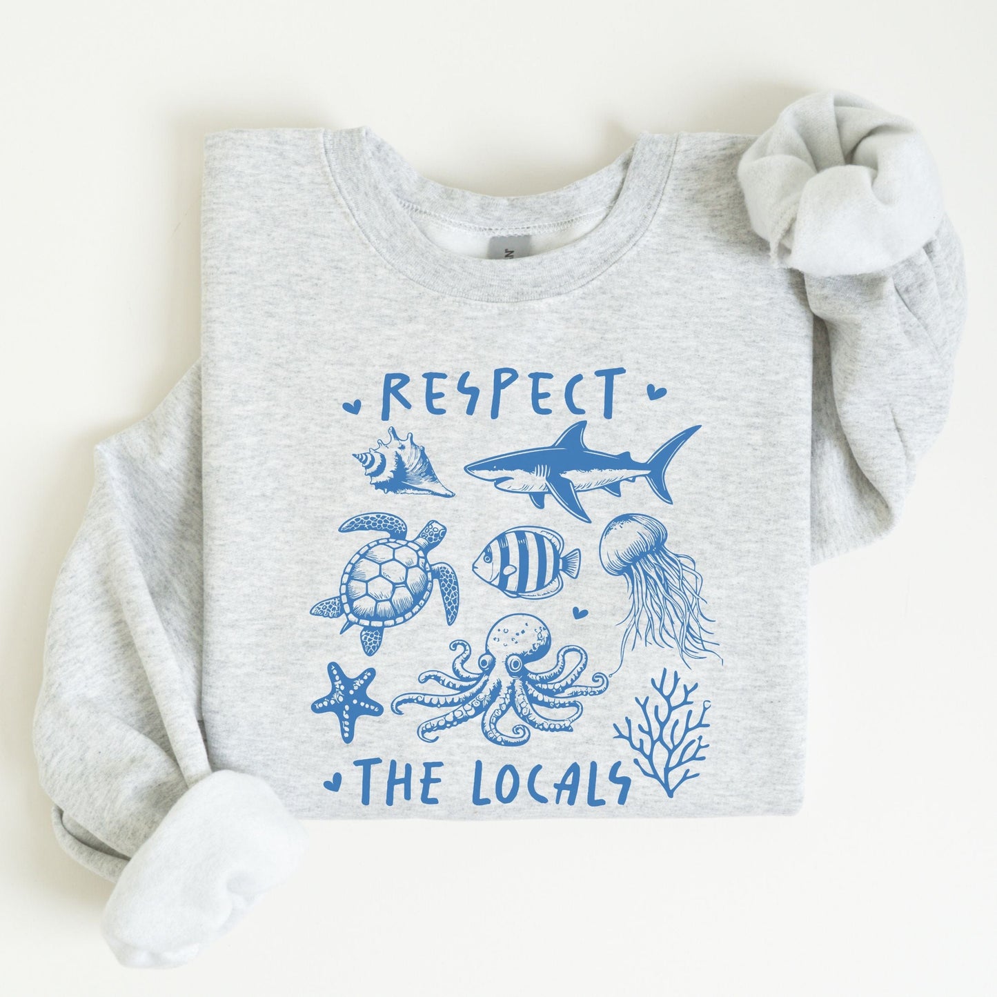 Respect the Locals sweatshirt with sea creatures in blue line art for ocean lovers