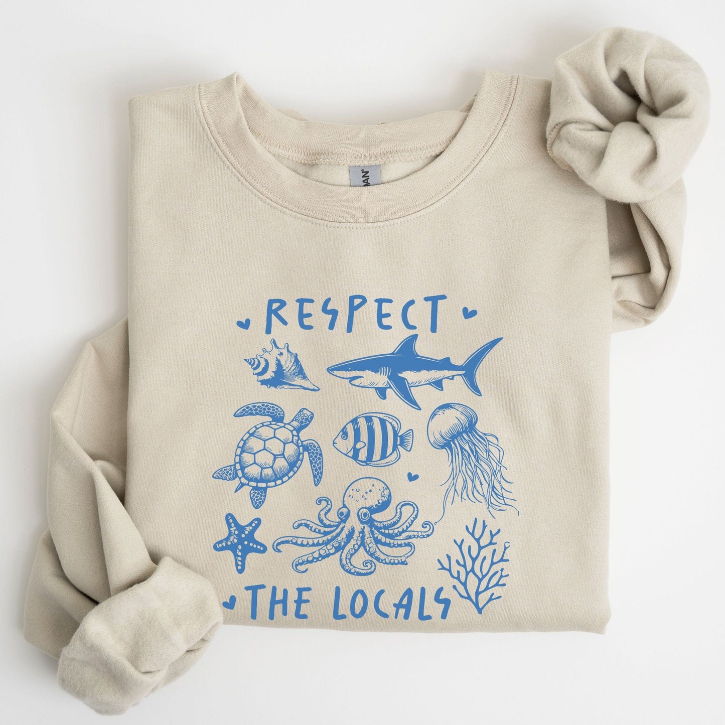 Respect the Locals sweatshirt with sea creatures in blue line art for ocean lovers