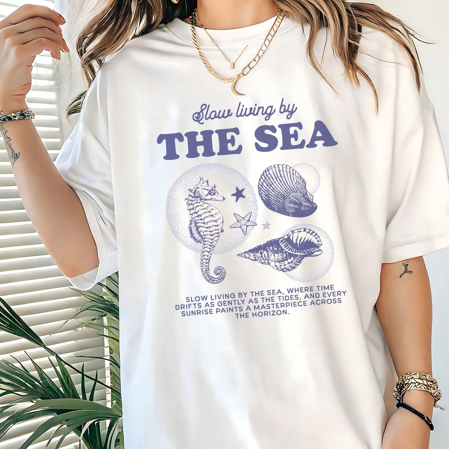 Vintage seahorse and shell graphic with "Slow Living by the Sea" text on t-shirt
