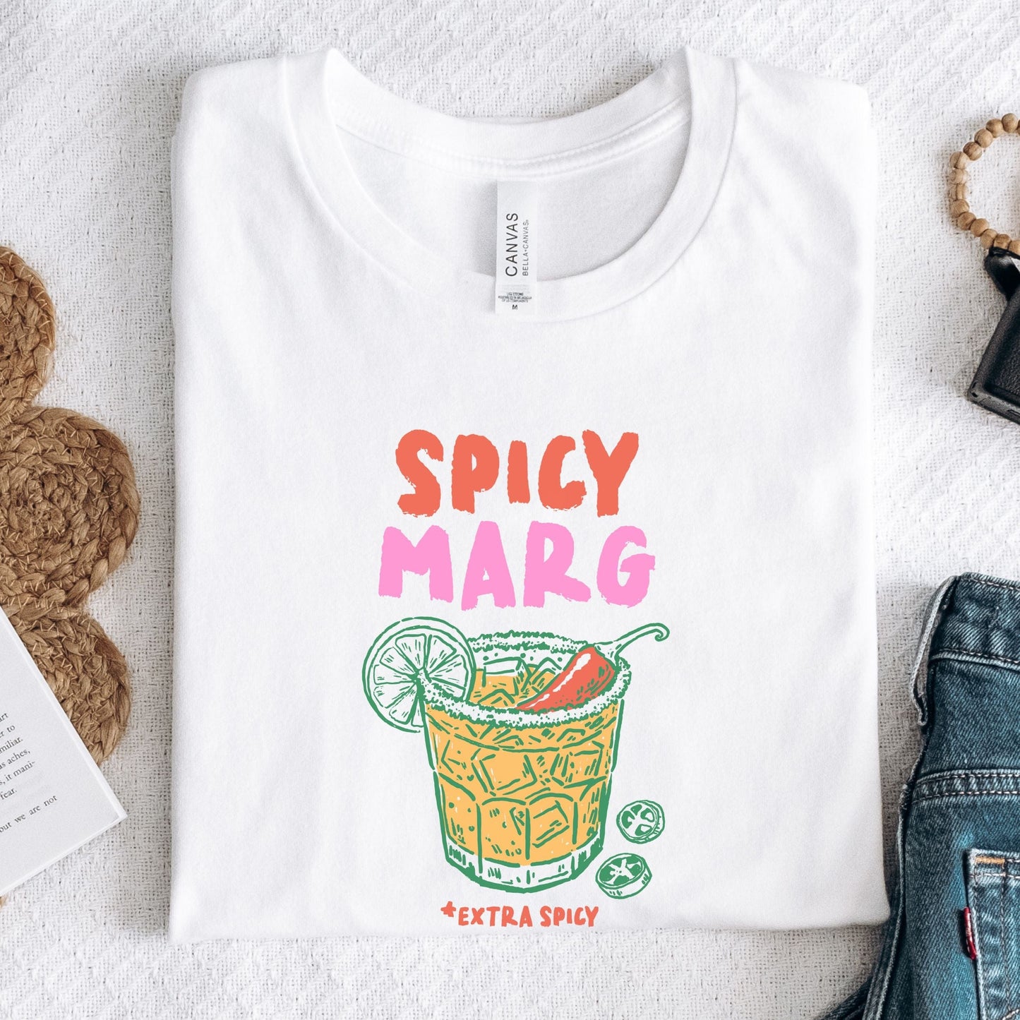 Hand-drawn spicy margarita graphic t-shirt with vibrant drink and lime illustration on soft cotton tee in white