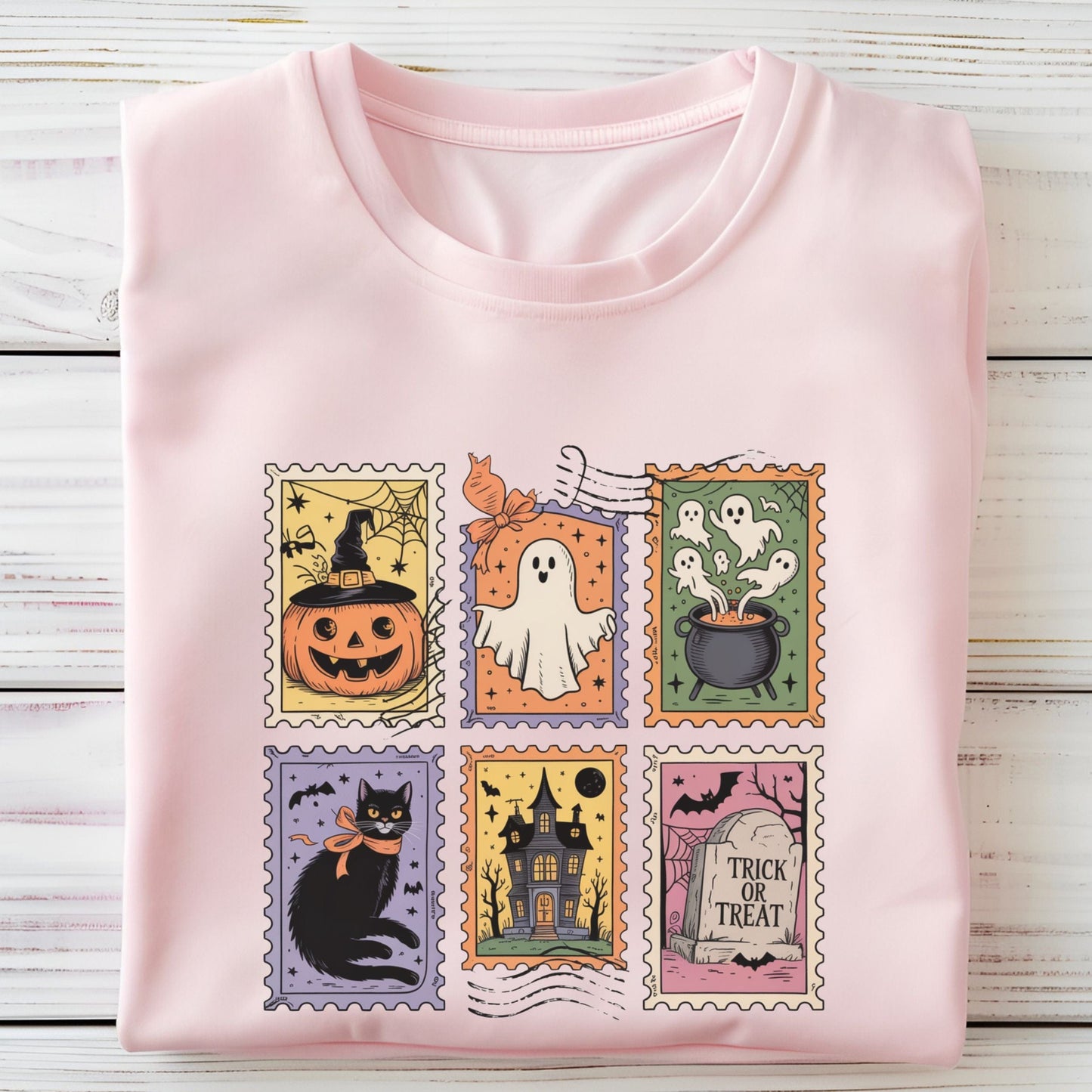 Vintage Halloween t-shirt with postage stamp illustrations of ghosts, pumpkins, black cat, haunted house, and trick-or-treat
