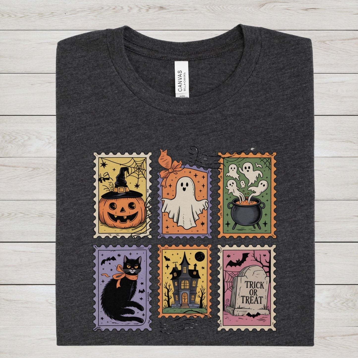 Vintage Halloween t-shirt with postage stamp illustrations of ghosts, pumpkins, black cat, haunted house, and trick-or-treat