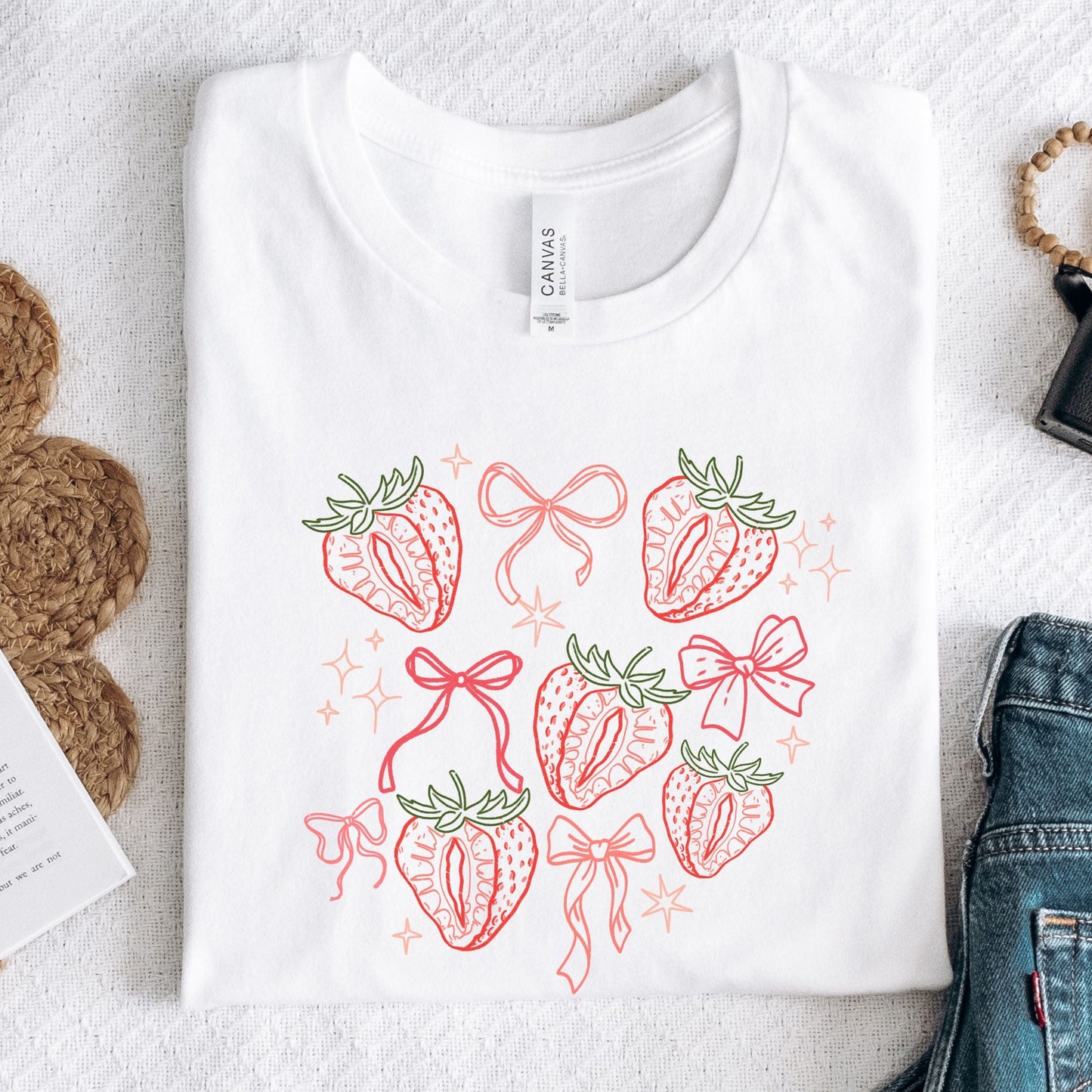 Cute strawberry and bow aesthetic t-shirt in pink and red line art on soft cotton
