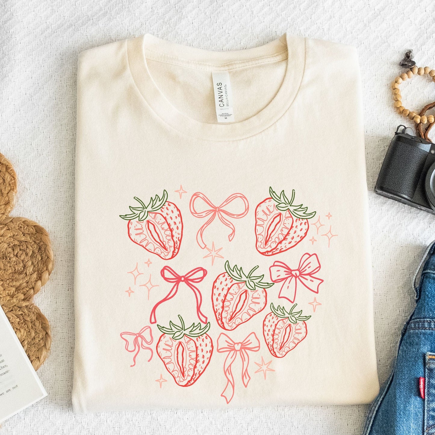 Cute strawberry and bow aesthetic t-shirt in pink and red line art on soft cotton