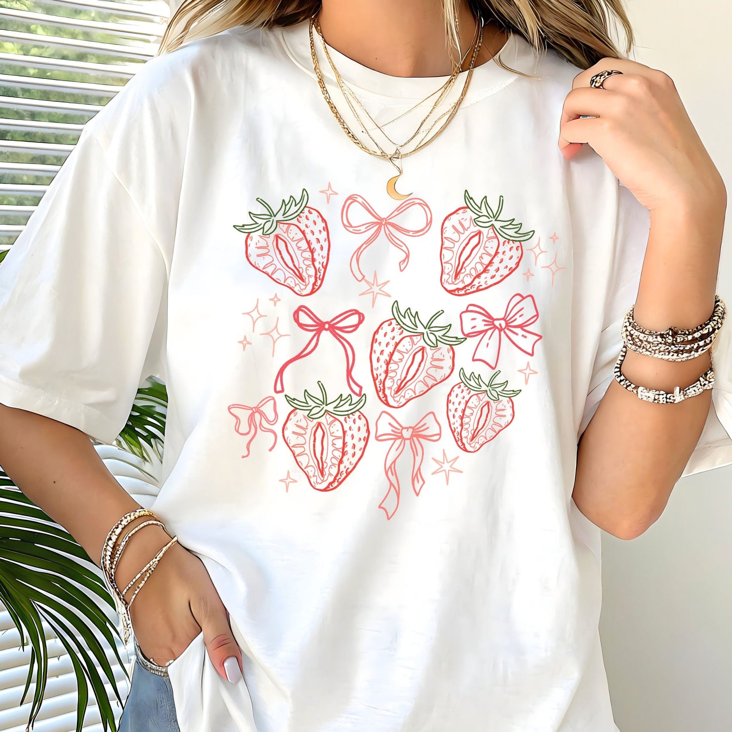 Cute strawberry and bow aesthetic t-shirt in pink and red line art on soft cotton