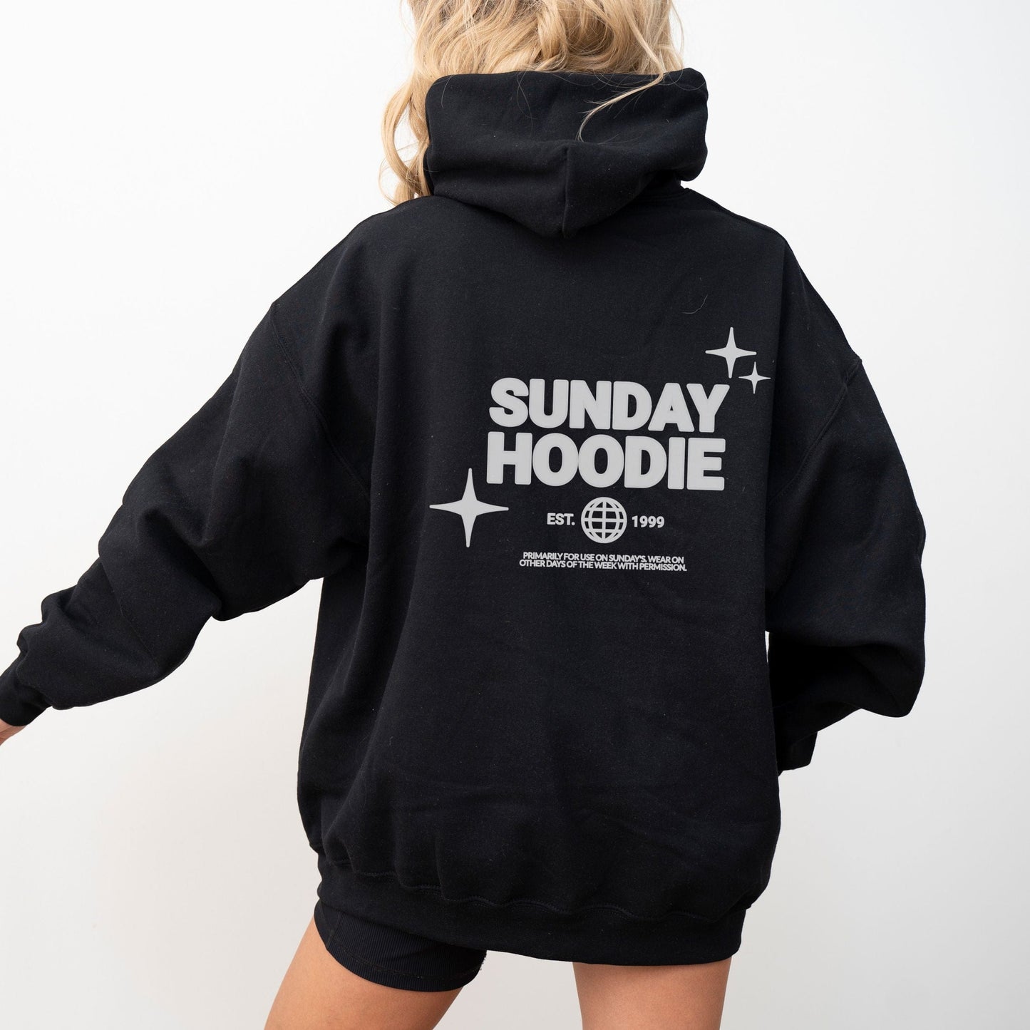 Hoodie with back graphic that says "Sunday Hoodie" with globe and star icons. Comfy loungewear perfect for slow weekends and casual days.