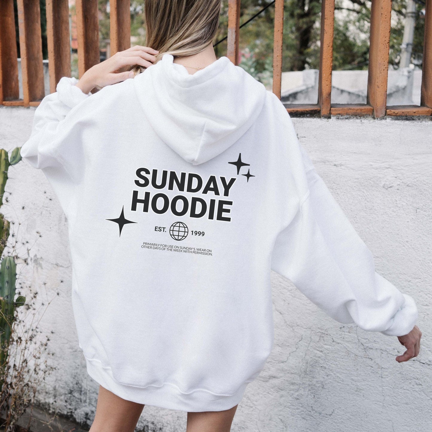 Hoodie with back graphic that says "Sunday Hoodie" with globe and star icons. Comfy loungewear perfect for slow weekends and casual days.