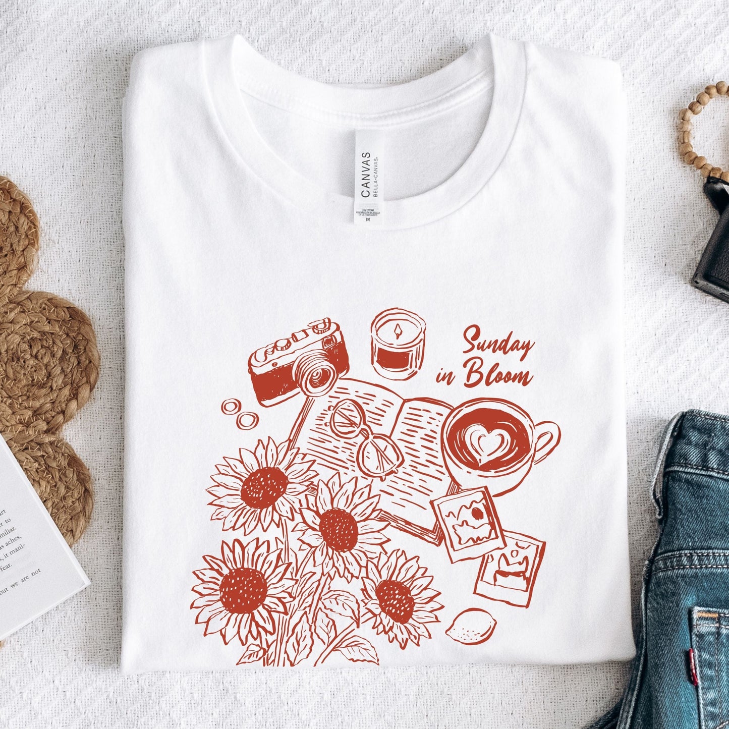 T-shirt with 'Sunday in Bloom' design featuring coffee, book, flowers, and vintage camera in white
