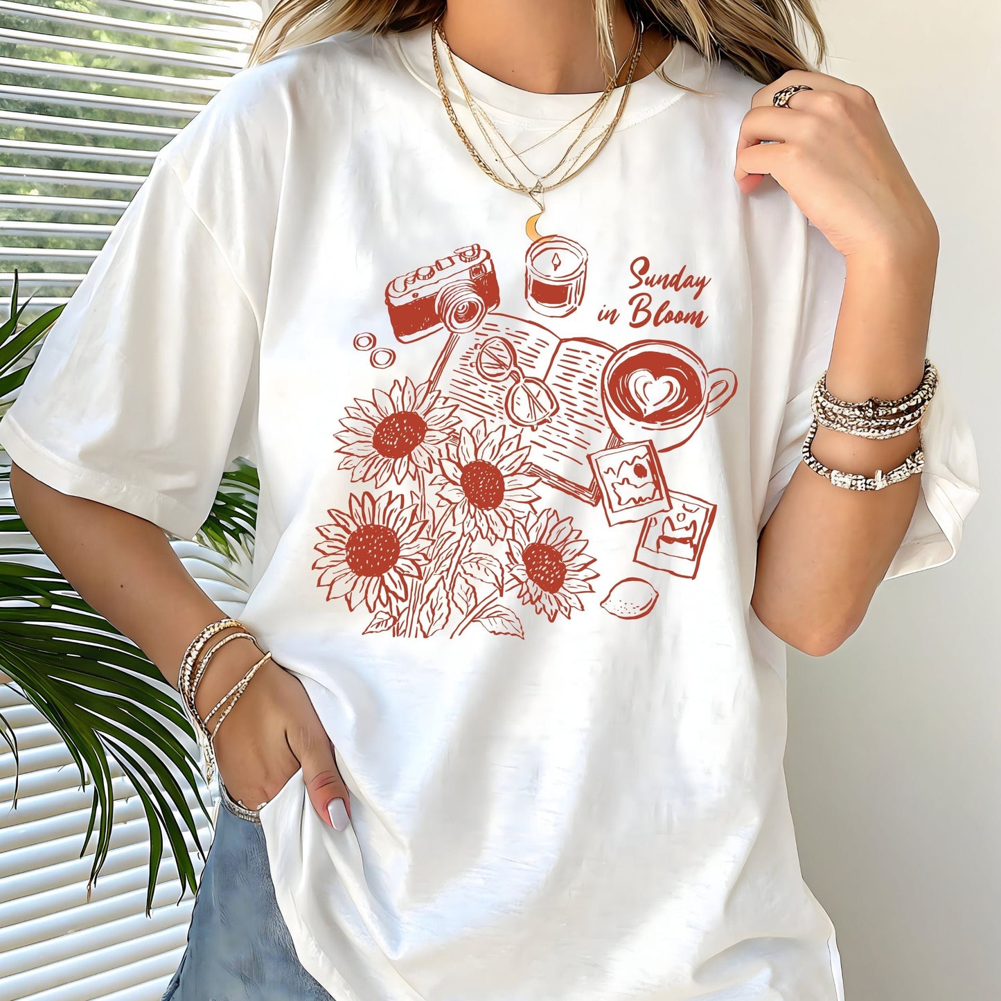 T-shirt with 'Sunday in Bloom' design featuring coffee, book, flowers, and vintage camera in white