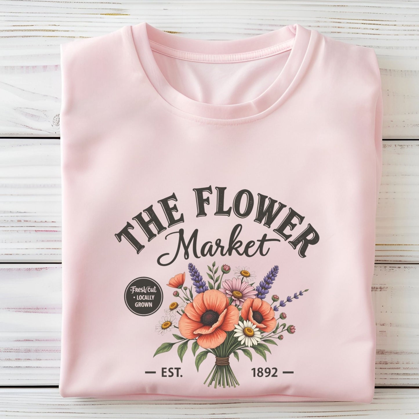 “The Flower Market” t-shirt with vintage typography and a bouquet of poppies, daisies, lavender, and wildflowers, featuring “Fresh Cut • Locally Grown.”