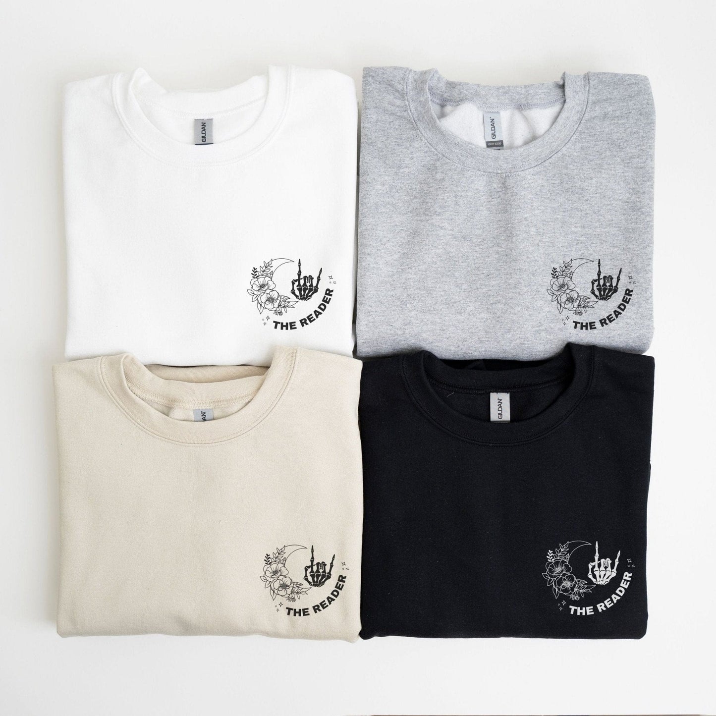 “The Reader Tarot” sweatshirt with mystical tarot card illustration printed on the back, perfect for book lovers and cozy fall vibes.