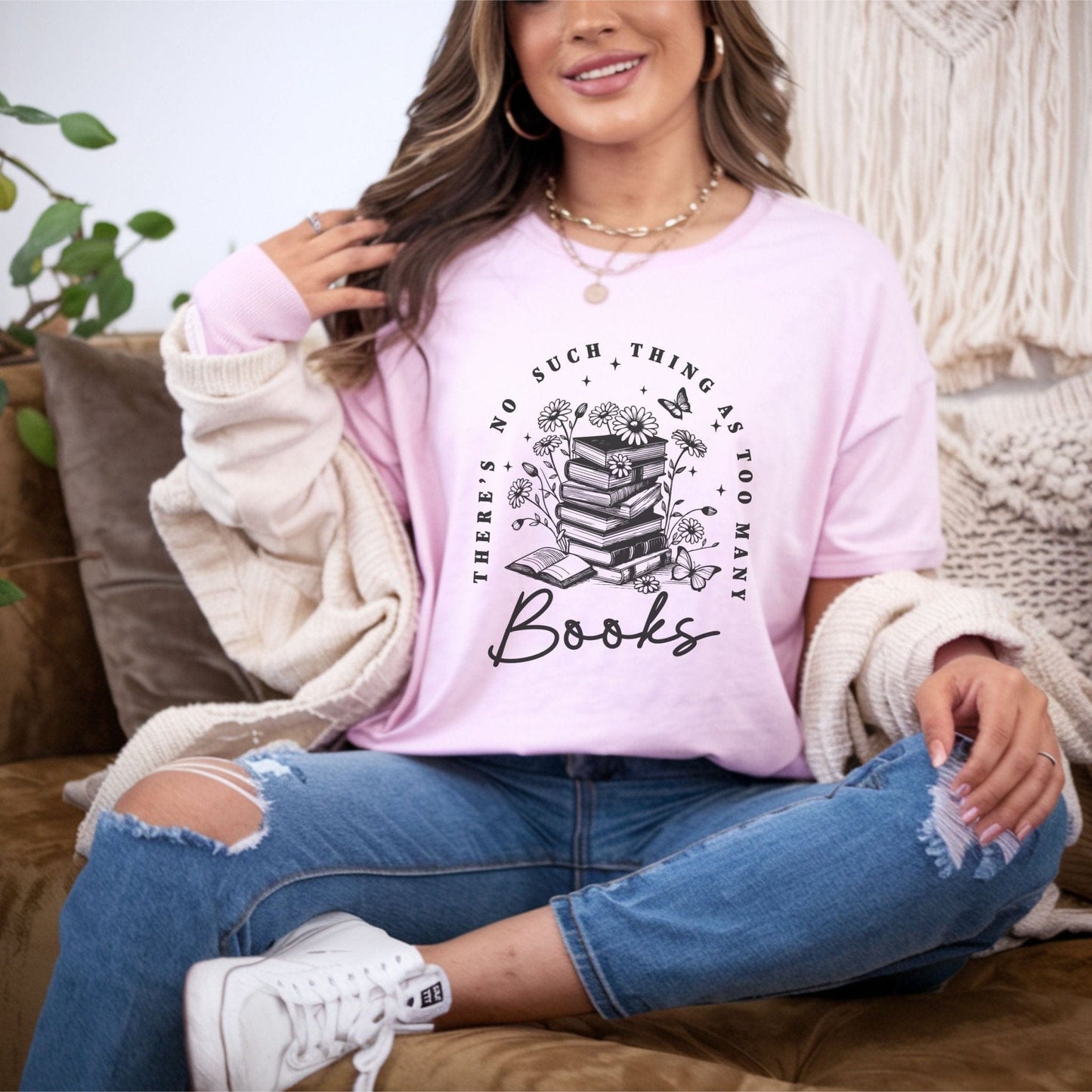 “Too Many Books, Not Enough Time” t-shirt with minimalist stacked books and handwritten lettering in black line art style.