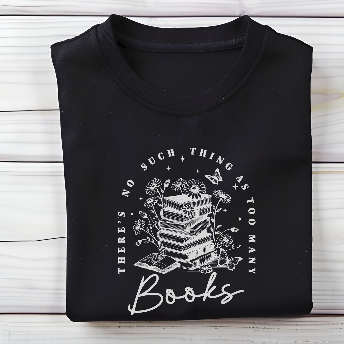 “Too Many Books, Not Enough Time” t-shirt with minimalist stacked books and handwritten lettering in black line art style.