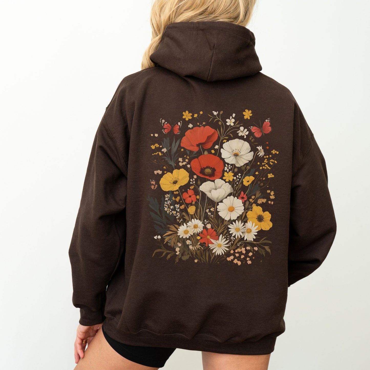Back of hoodie with vintage wildflower bouquet and butterflies — cozy spring sweatshirt for floral lovers.