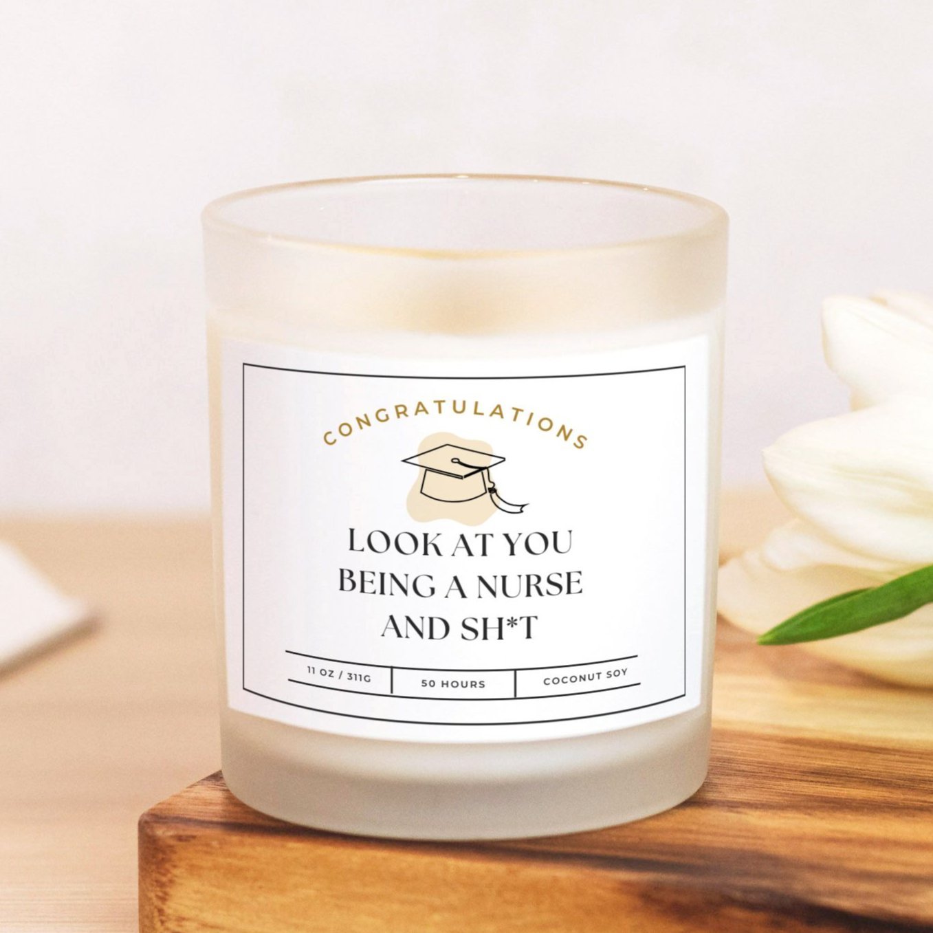 Frosted glass candle with "Look at You Being a Nurse and Sh*t" design for nursing graduates.