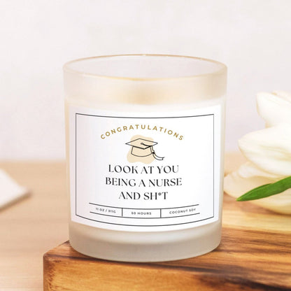 Frosted glass candle with "Look at You Being a Nurse and Sh*t" design for nursing graduates.