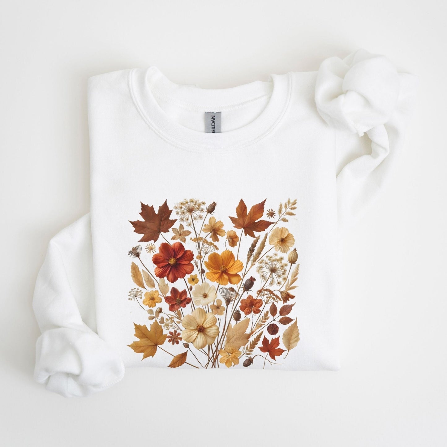 Fall floral sweatshirt with wildflower and autumn leaf design.